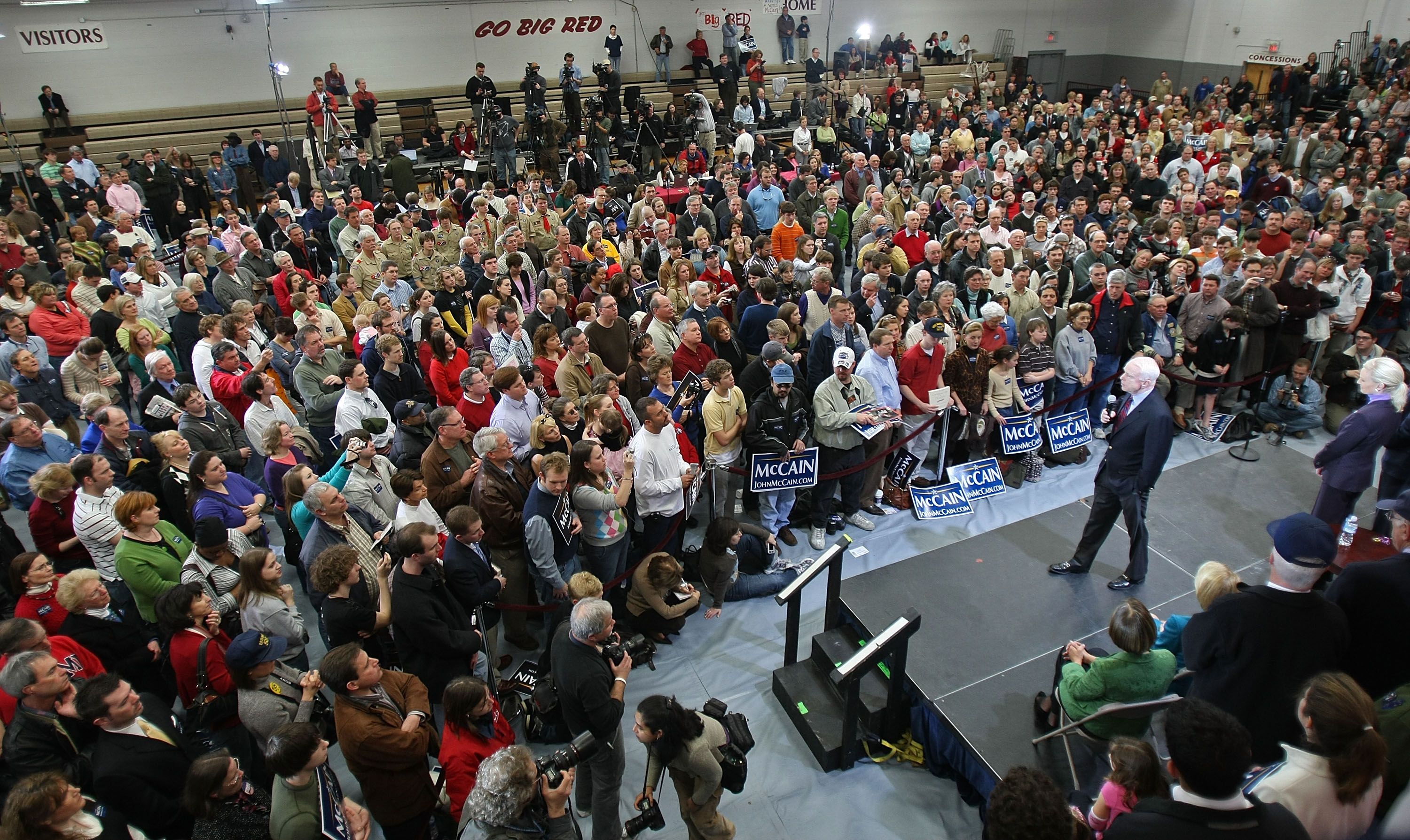 John McCain speaks in a high school gym.