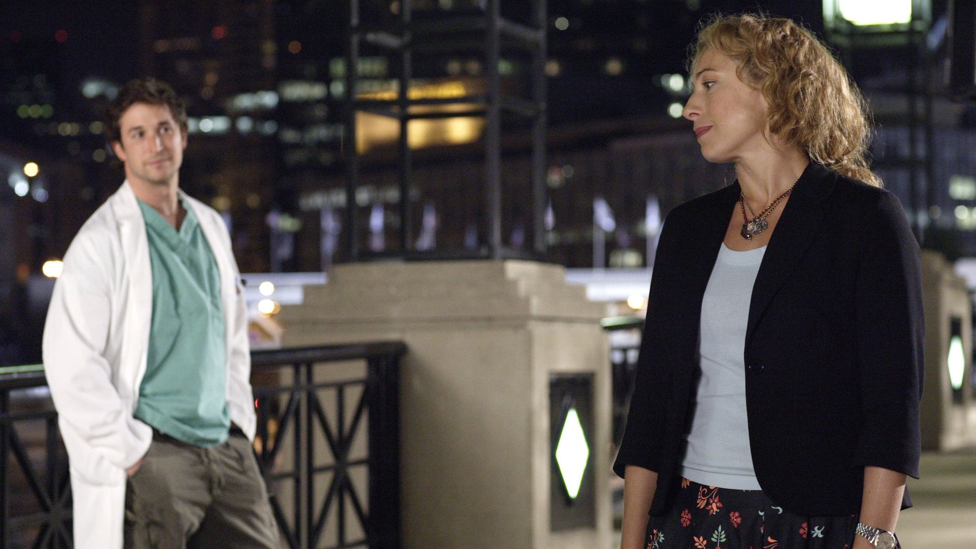 Two people on a bridge in Chicago.