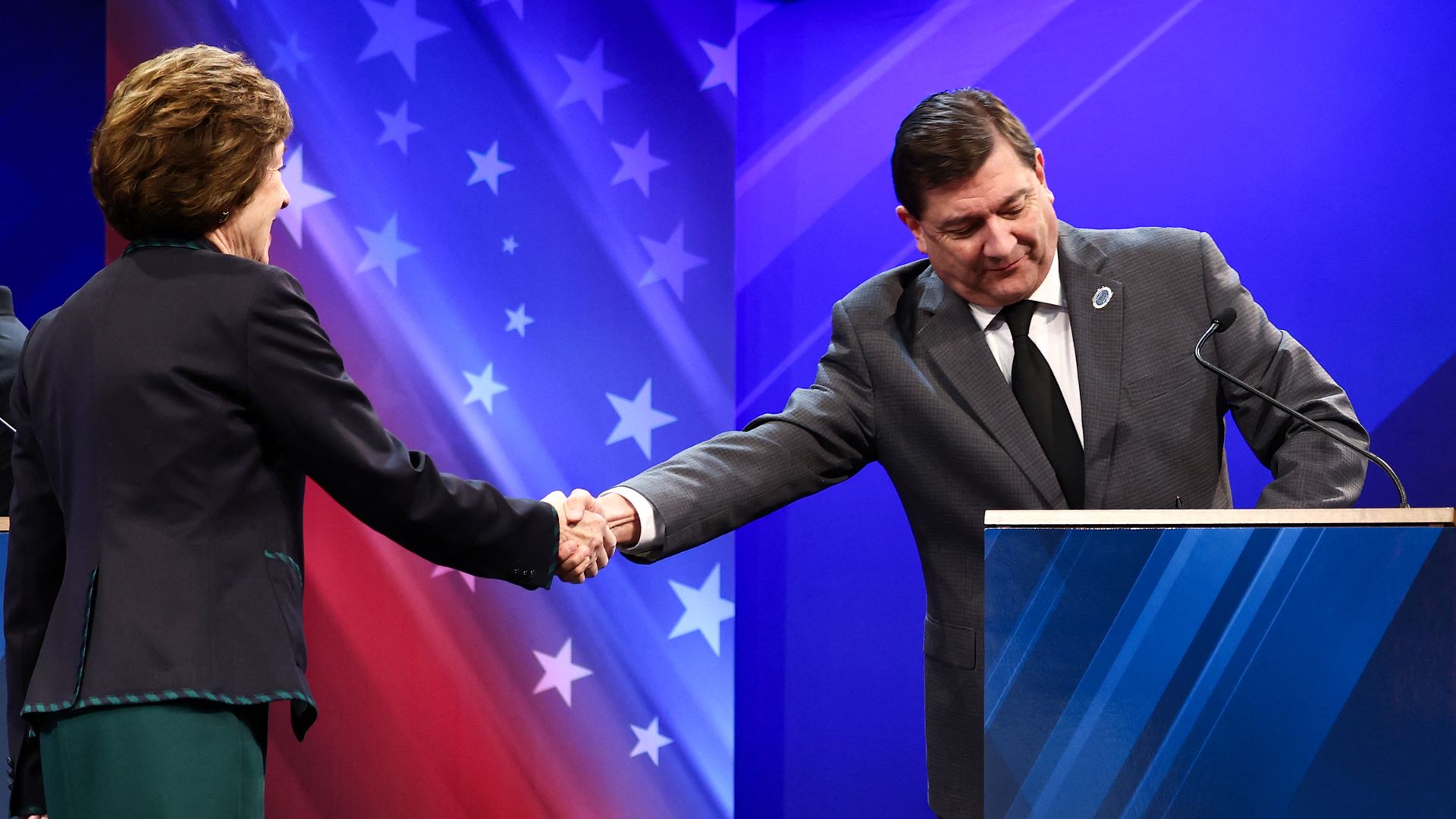 Democratic Senate candidate Troy Jackson shakes hands with Sen. Susan Collins (R-aine) before their debate on Oct. 15, 2026.