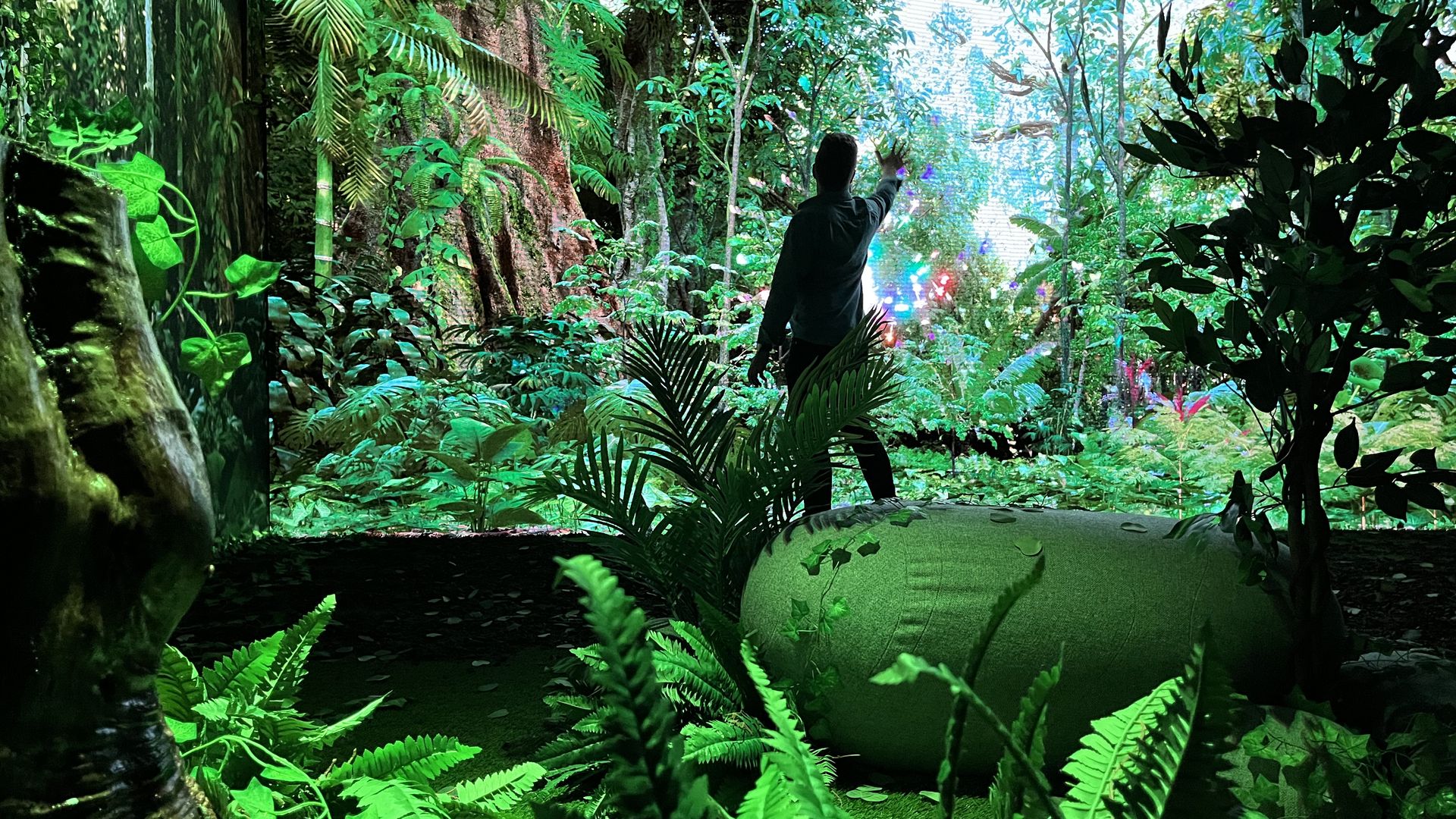 A visitor interacts with an LED wall at an exhibit at Ignite Broward.