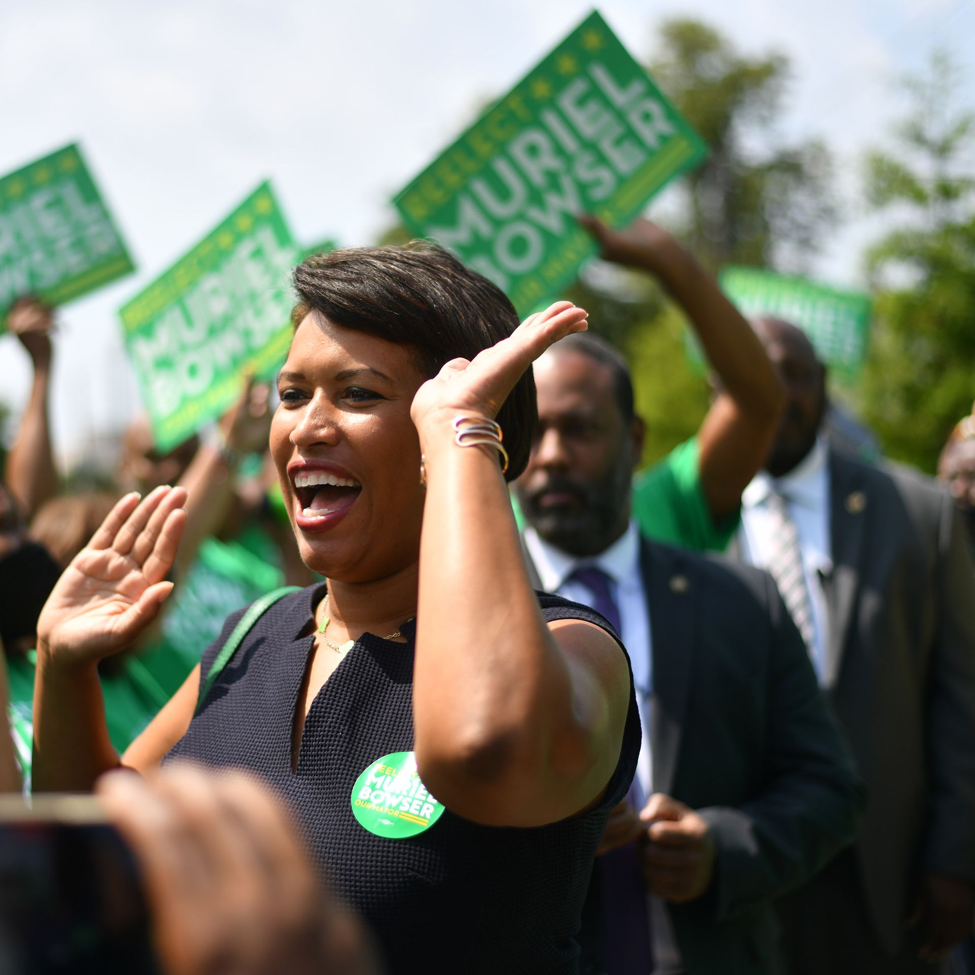 Muriel Bowser surrounded by supporters