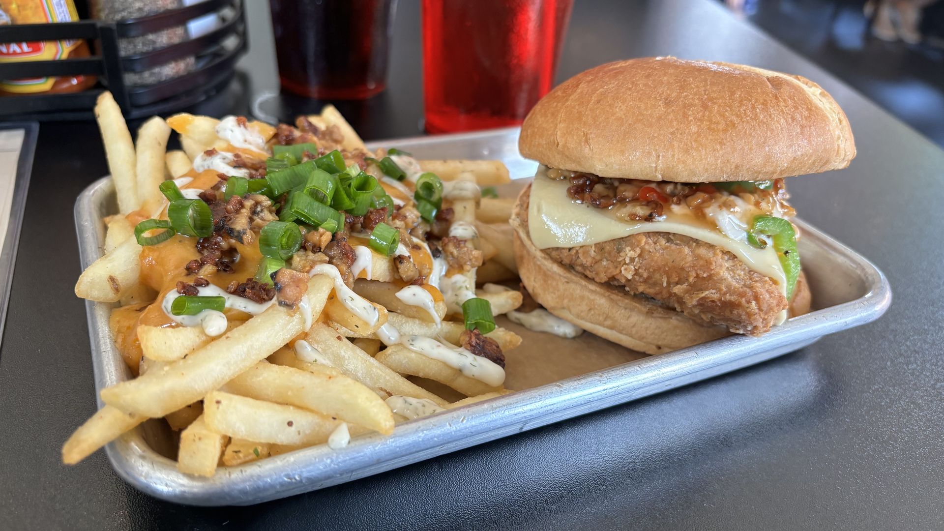 A sandwich and fries on a tray