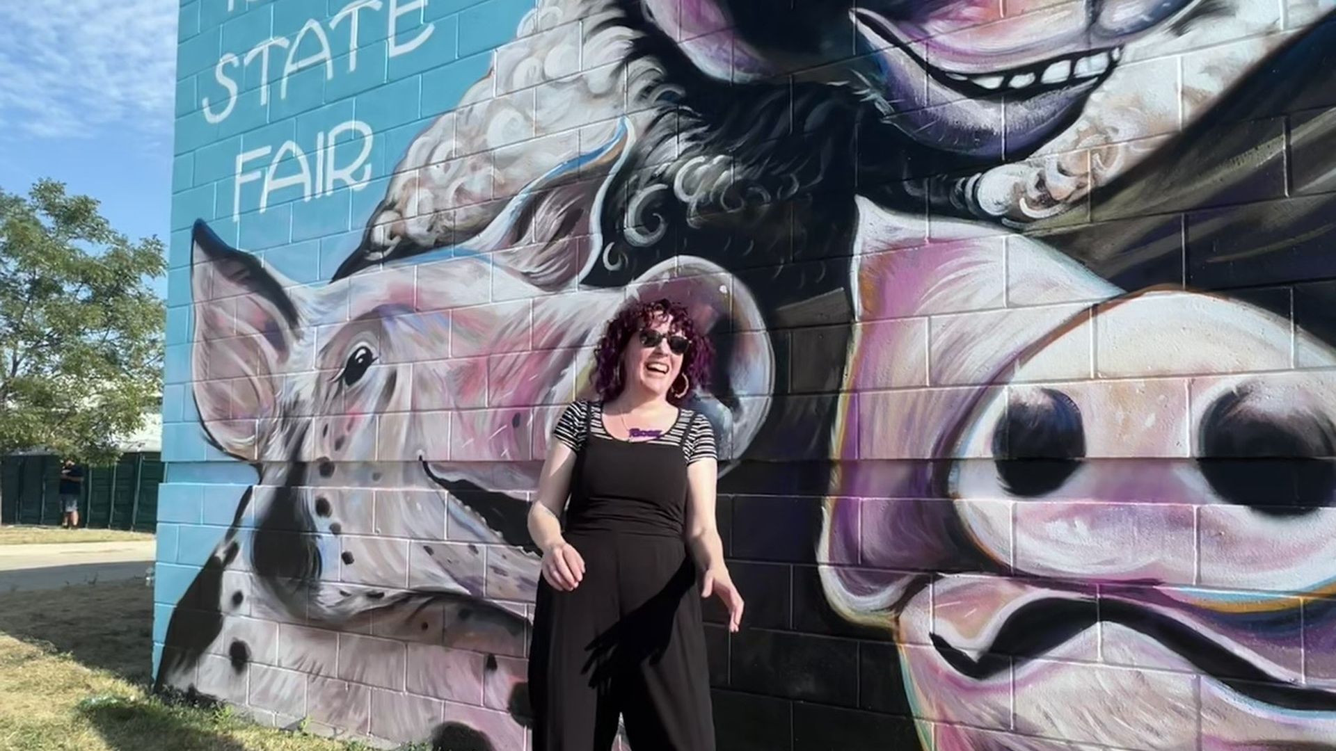 Sarah Booz in front of Iowa State Fair mural