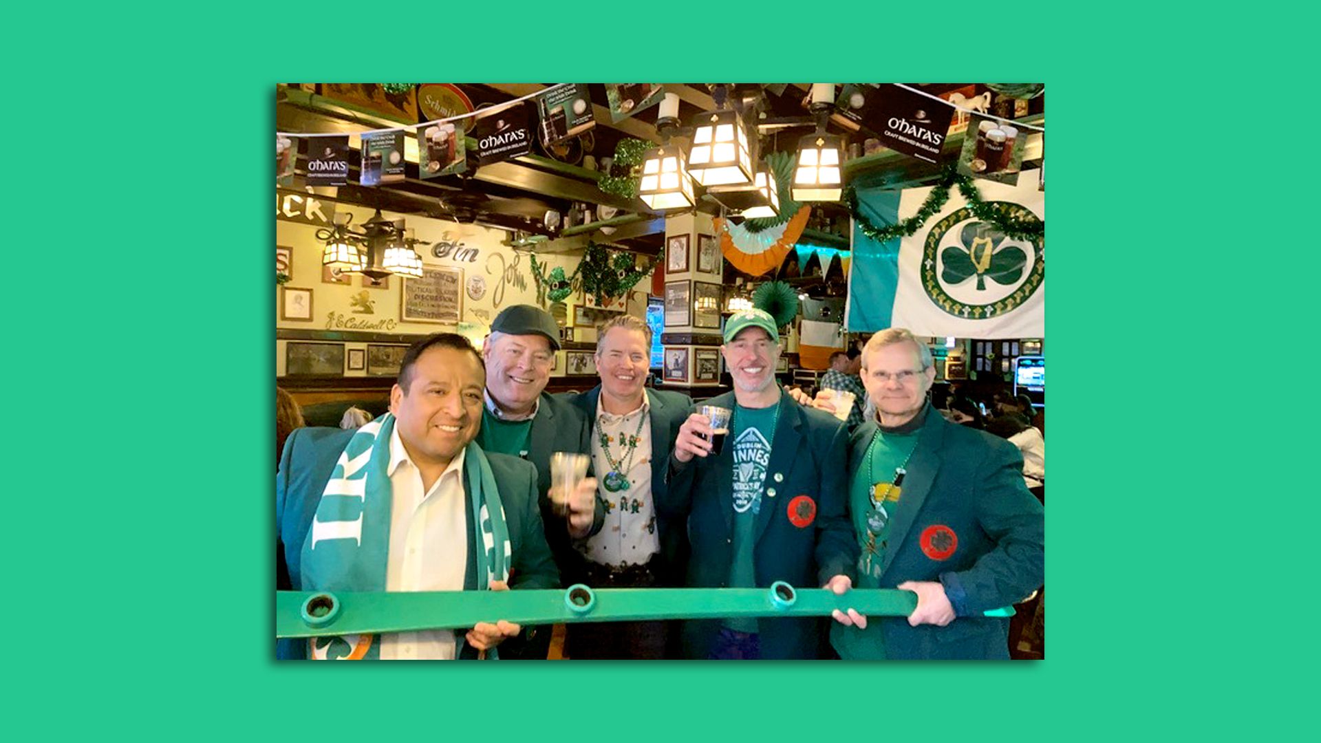 People raise their glasses inside McGillin’s Olde Ale House
