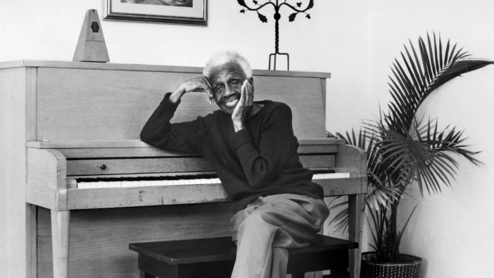 Ruth Ellis at a piano.