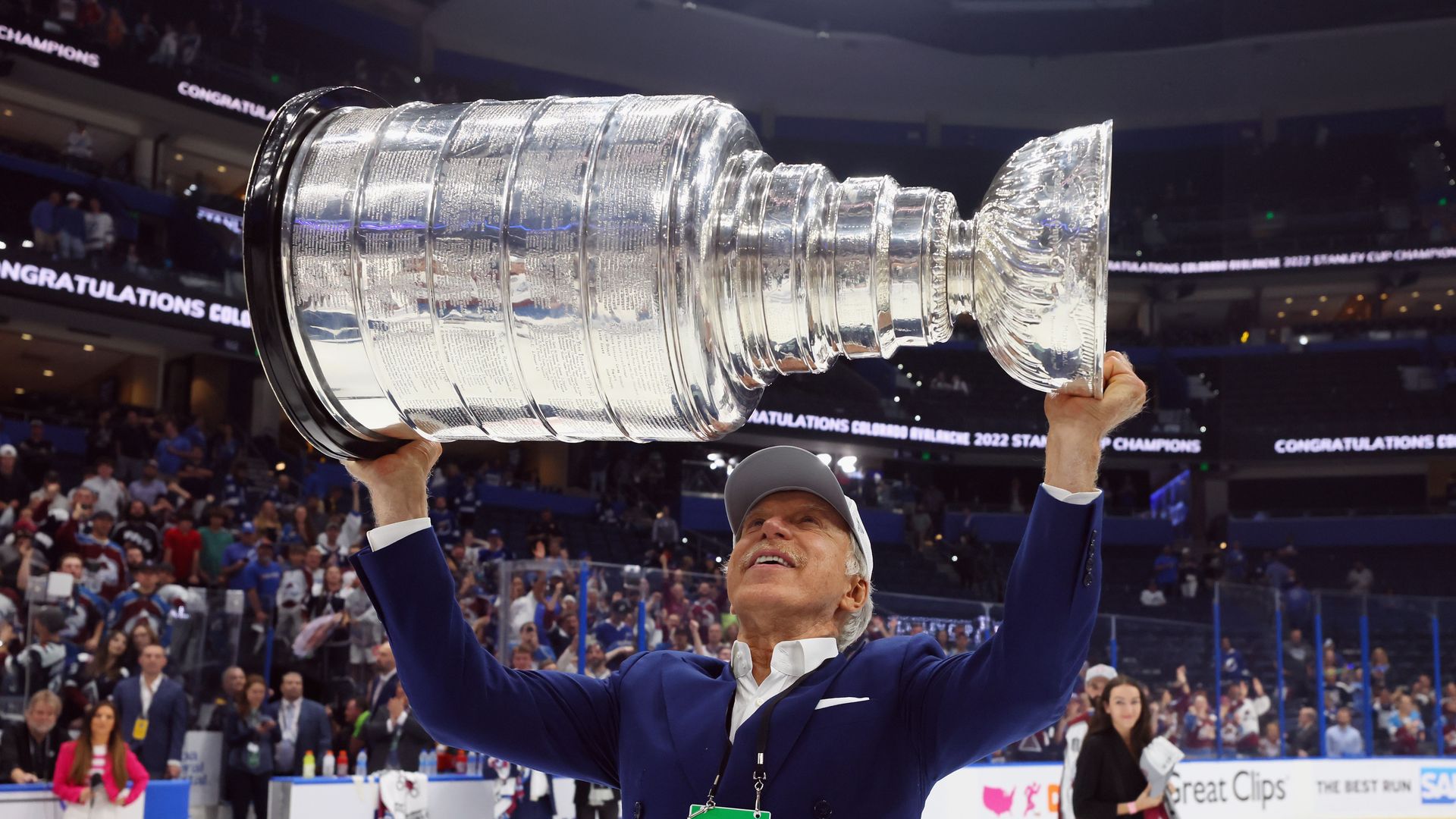 TAMPA, FLORIDA - JUNE 26: E. Stanley Kroenke of the Colorado Avalanche carries the Stanley Cup following the series winning victory over the Tampa Bay Lightning in Game Six of the 2022 NHL Stanley Cup Final at Amalie Arena on June 26, 2022 in Tampa, Florida. (Photo by Bruce Bennett/Getty Images)