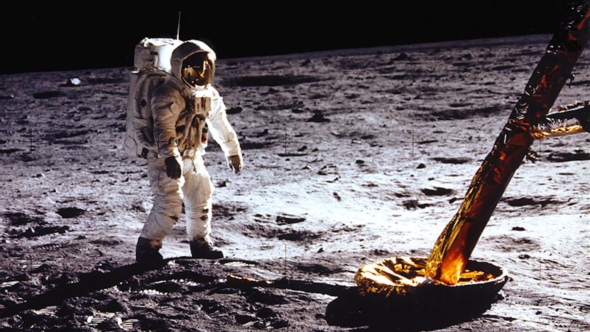 Apollo 11 astronaut Buzz Aldrin stands next to the lunar lander on the Moon.