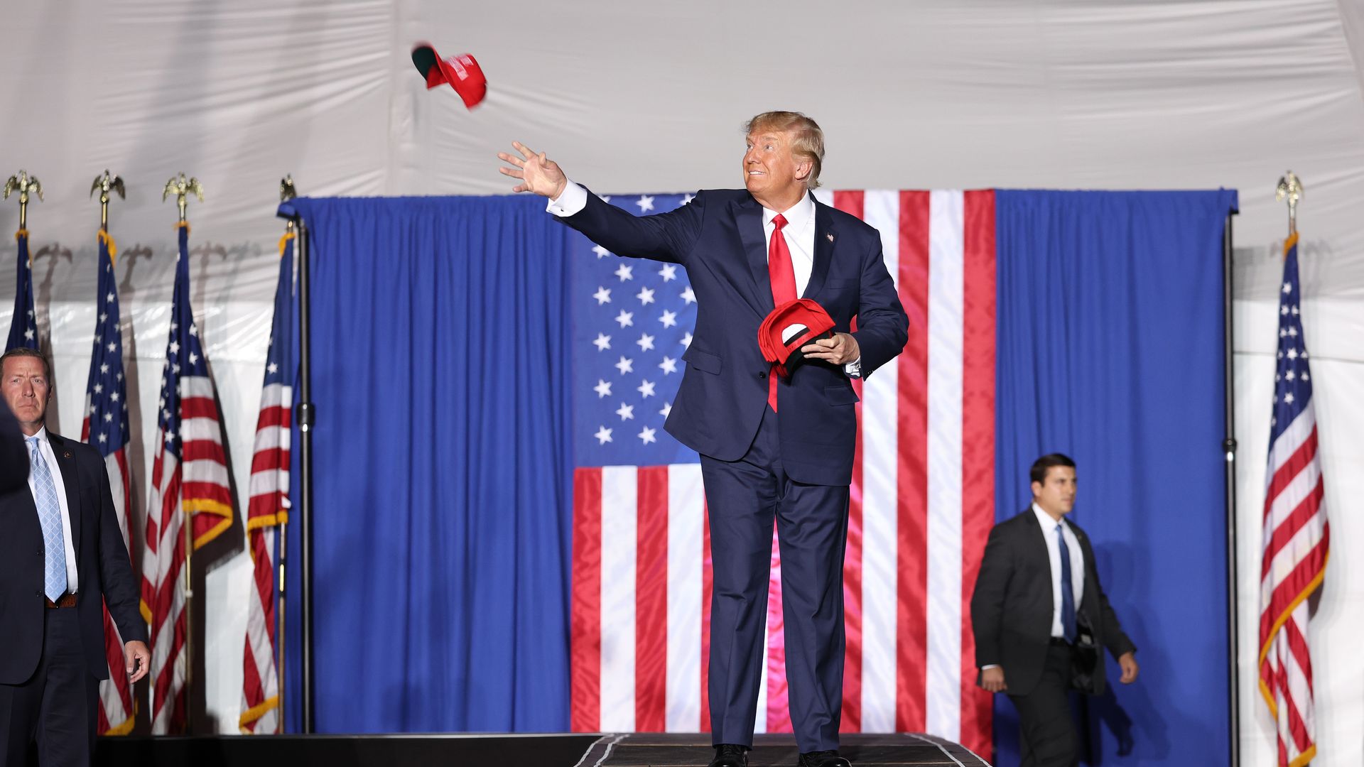 Trump throws hat