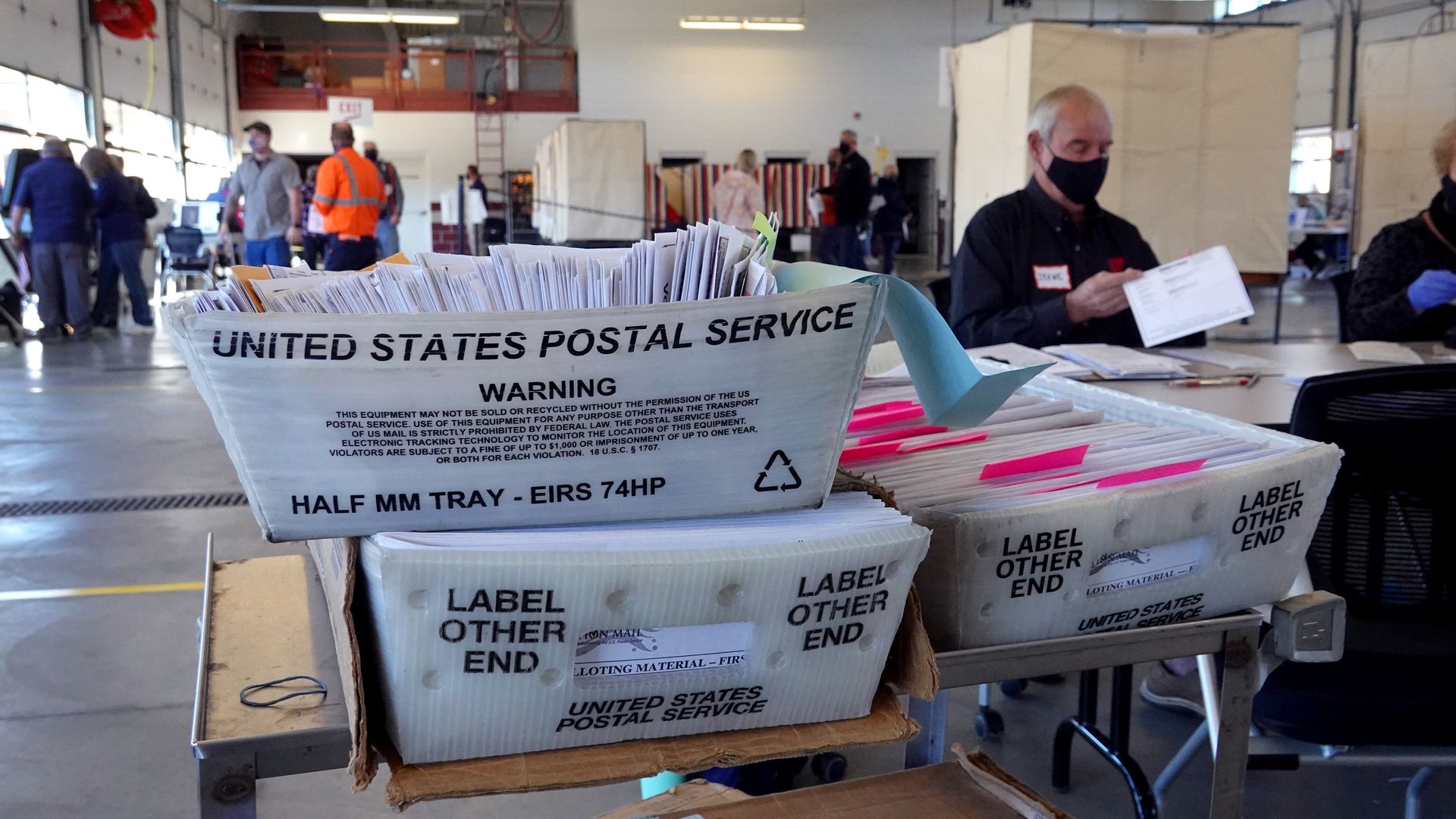 Election officials count absentee ballots at a polling place located in the Town of Beloit fire station on November 03, 2020 near Beloit, Wisconsin. 