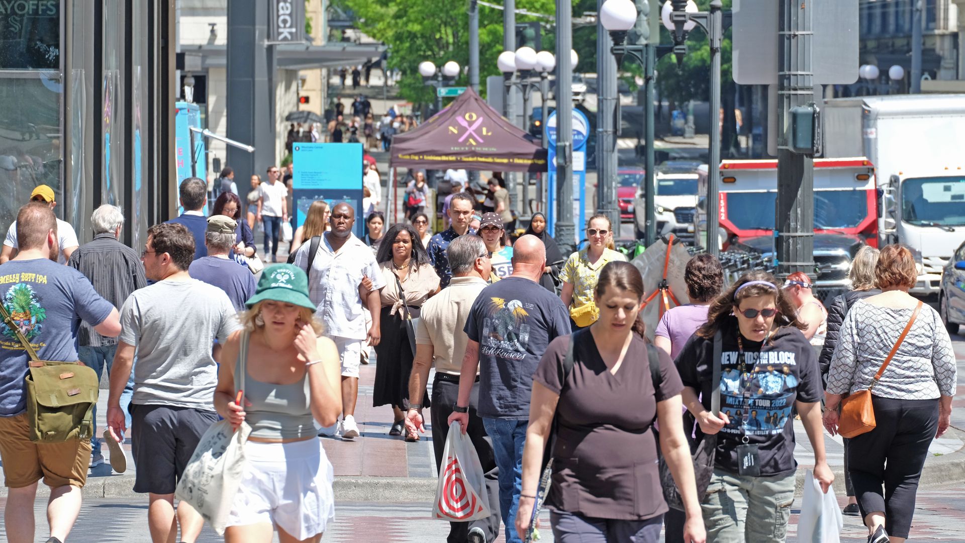 Street level view of a busy Seattle street on a sunny day. 
