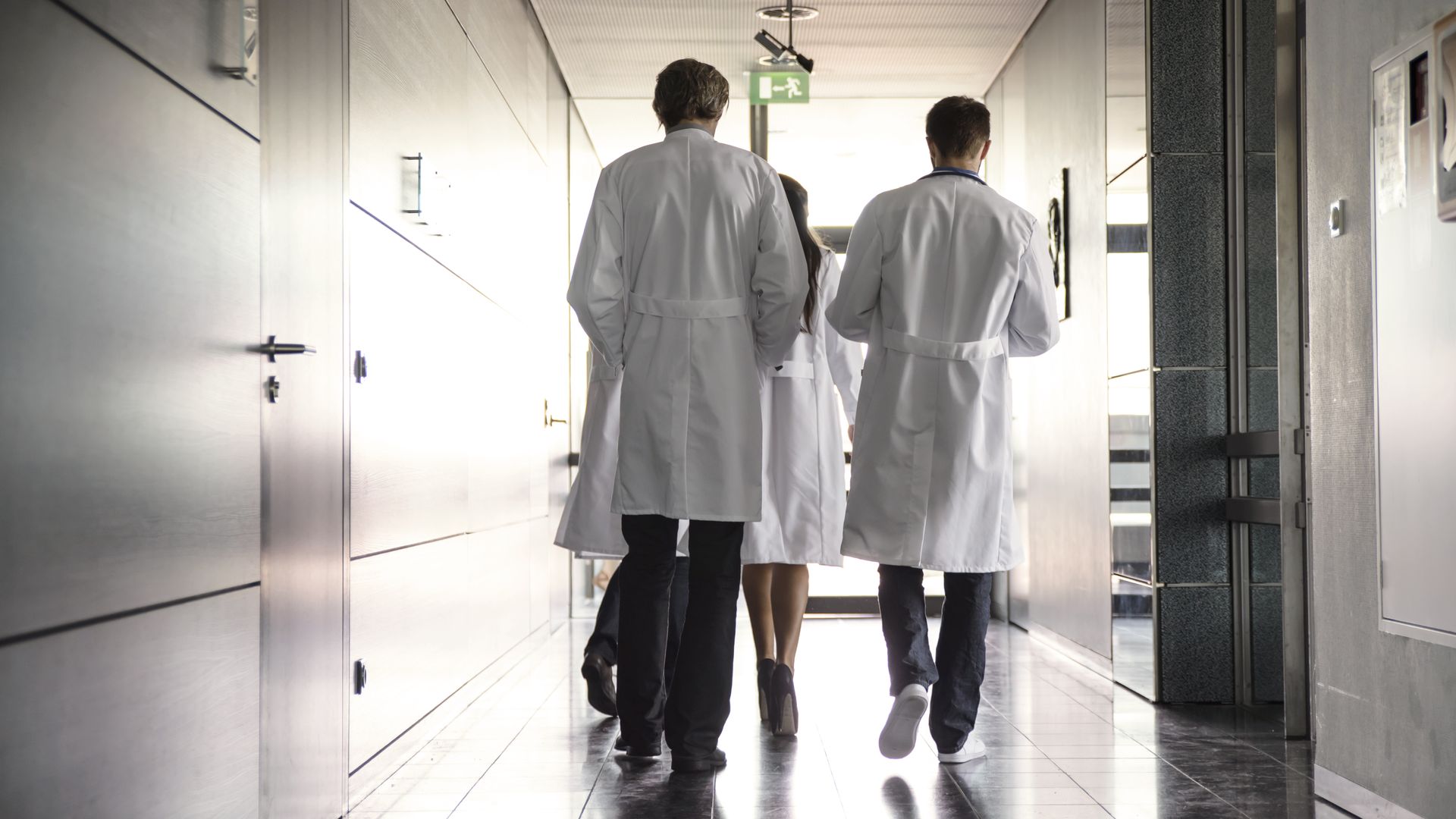 Team of doctors walking down a hall