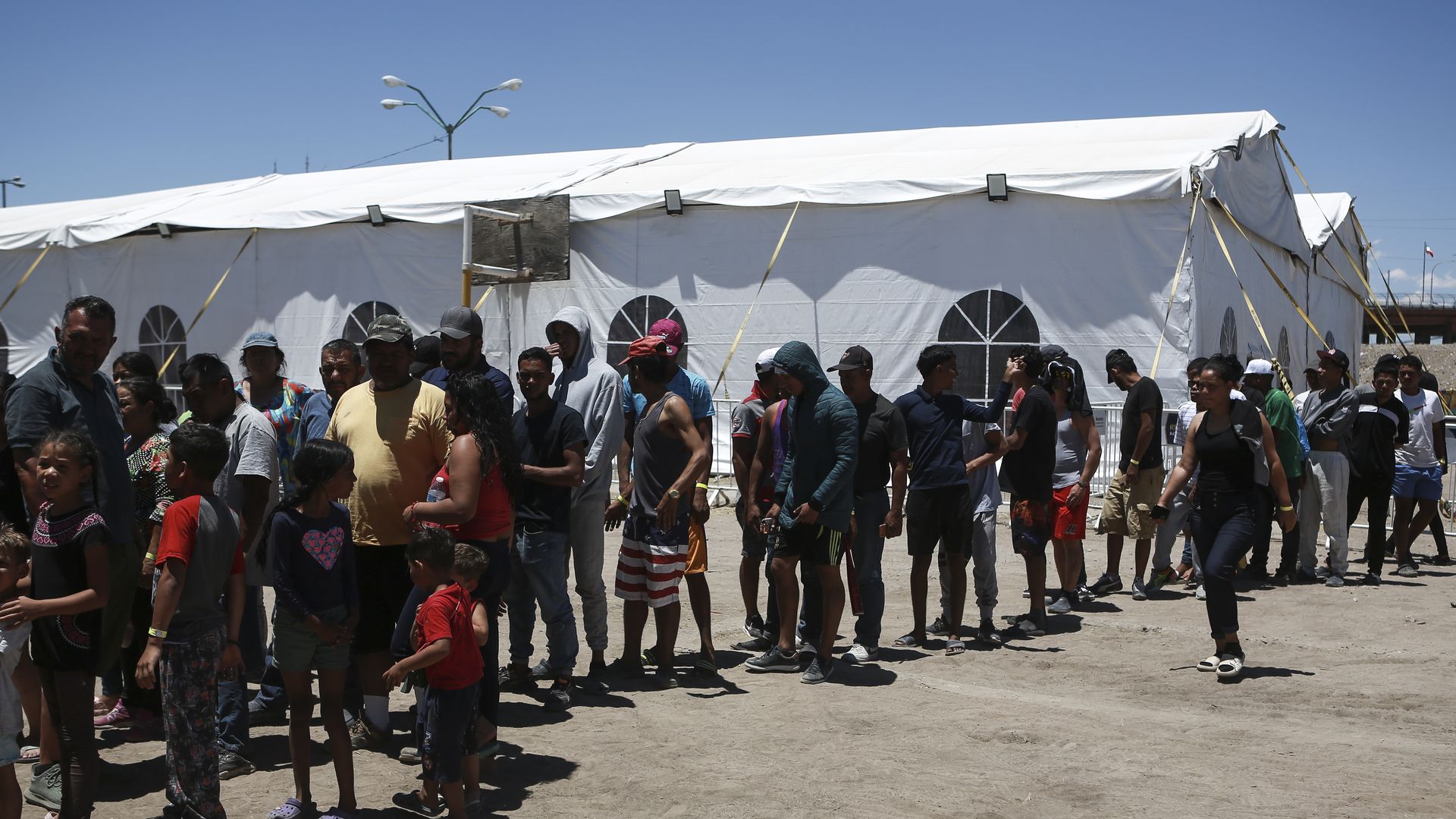 A line of migrants, mostly of Venezuelan descent,  waiting to enter shelter in Mexico as they await appointments through the US Customs and Border Protection (CBP) one application.