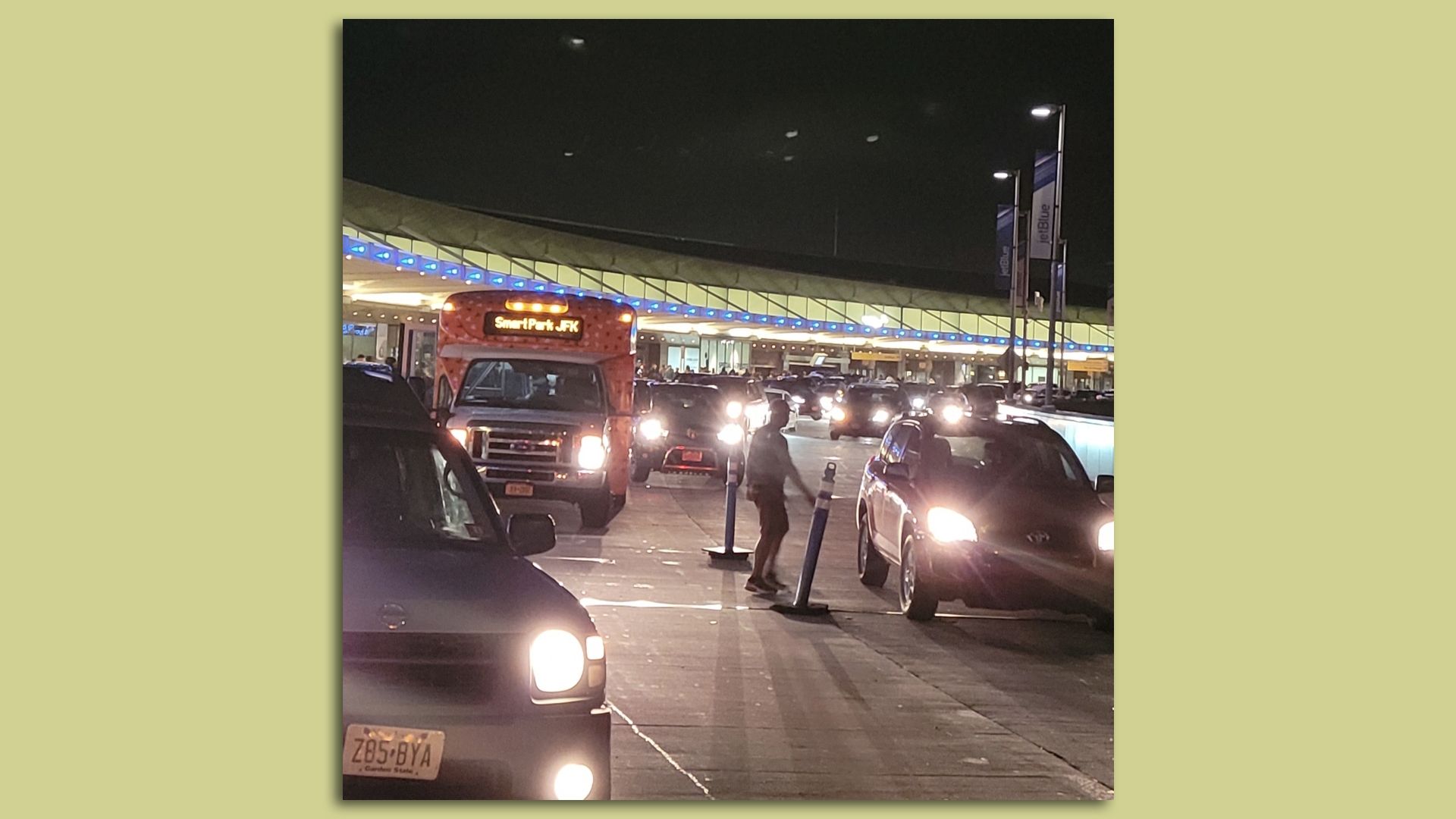 A busy taxi pickup scene at JFK airport in NYC at 4:30 a.m. on a recent weekday.