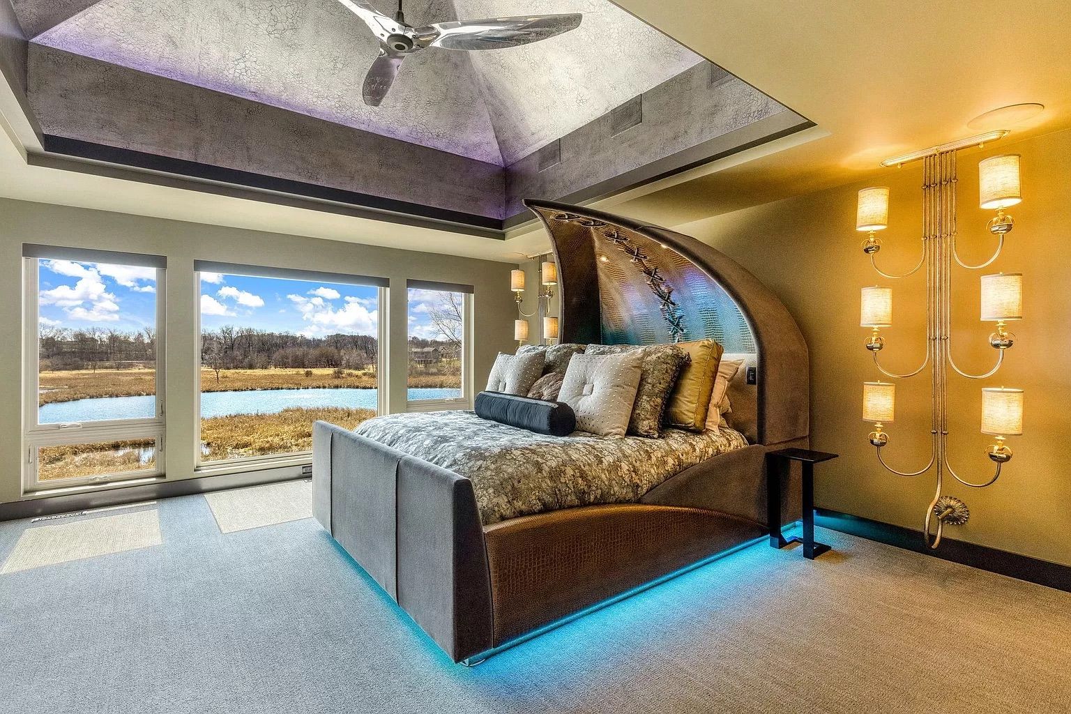 A room with a bed that looks like a half shell.