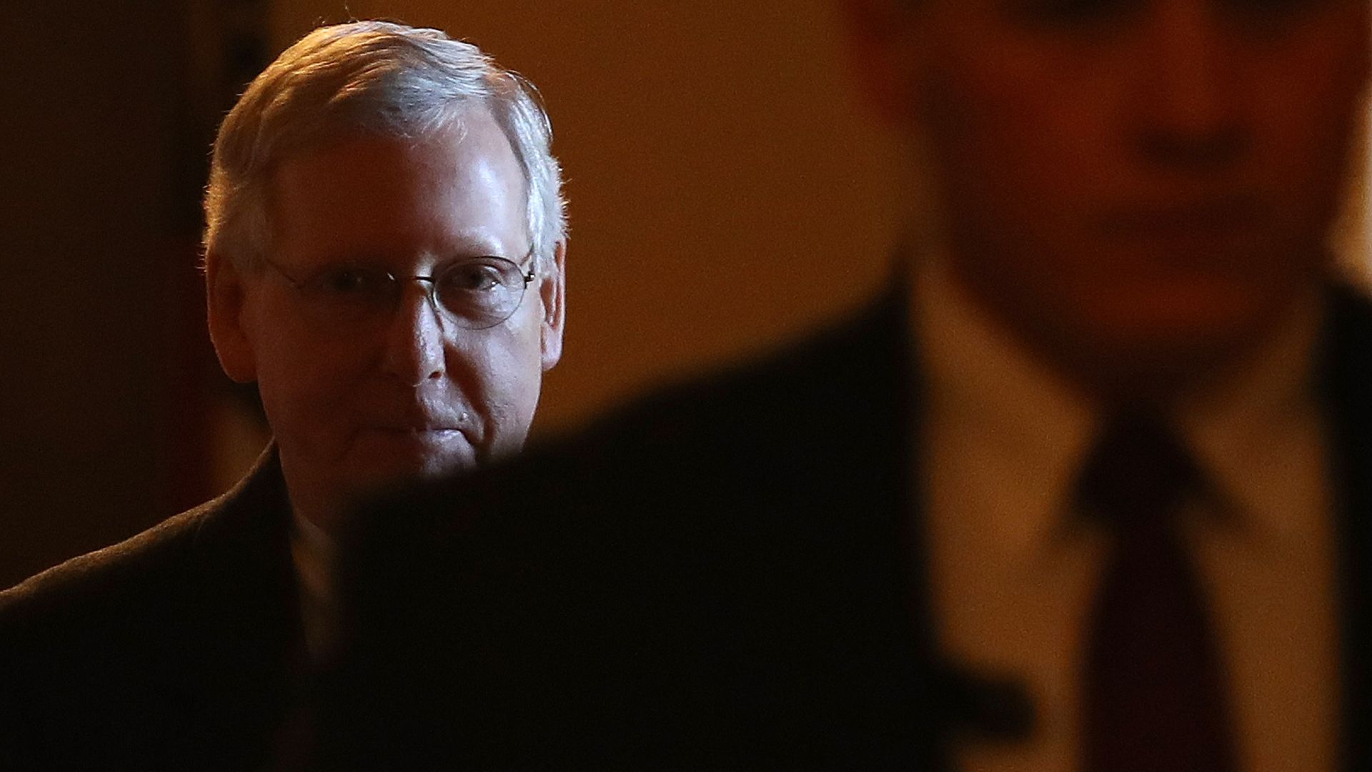 A mysterious and silhouetted Mitch McConnell