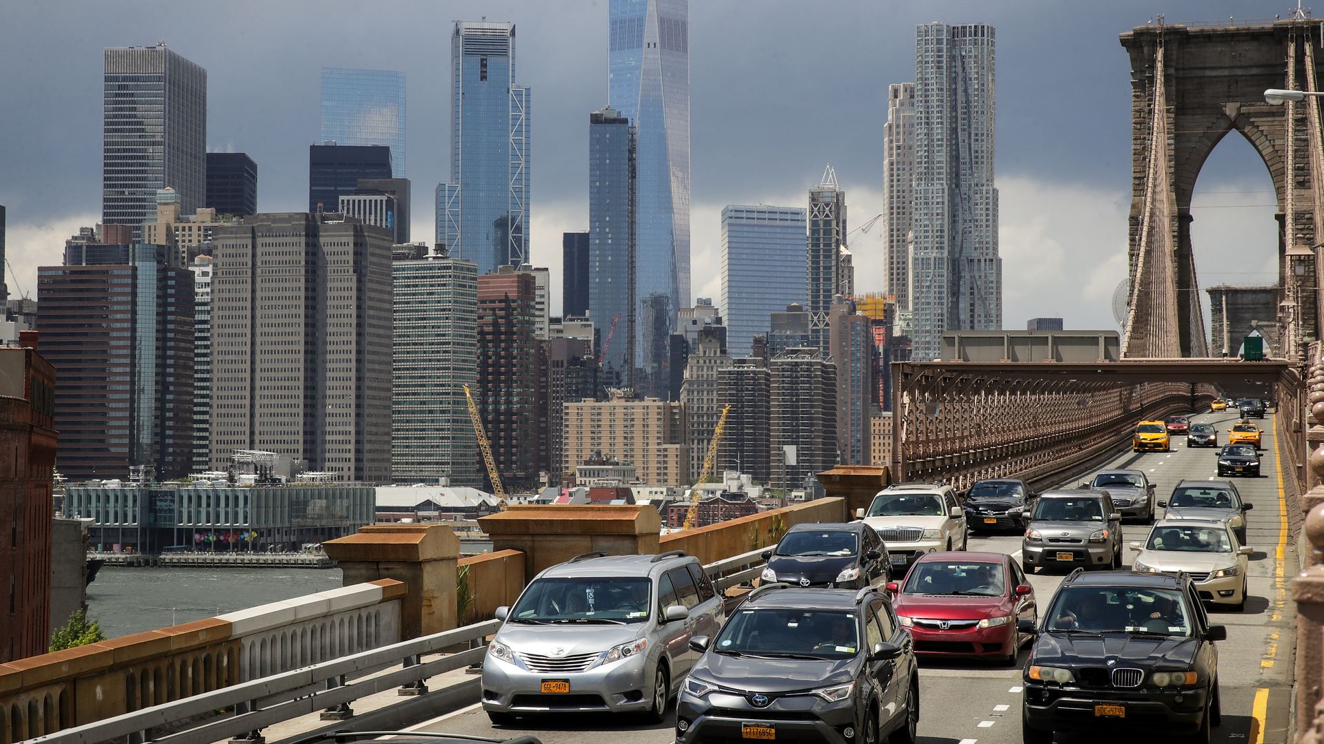 view of lower Manhattan and traffic on Brooklyn Bridge