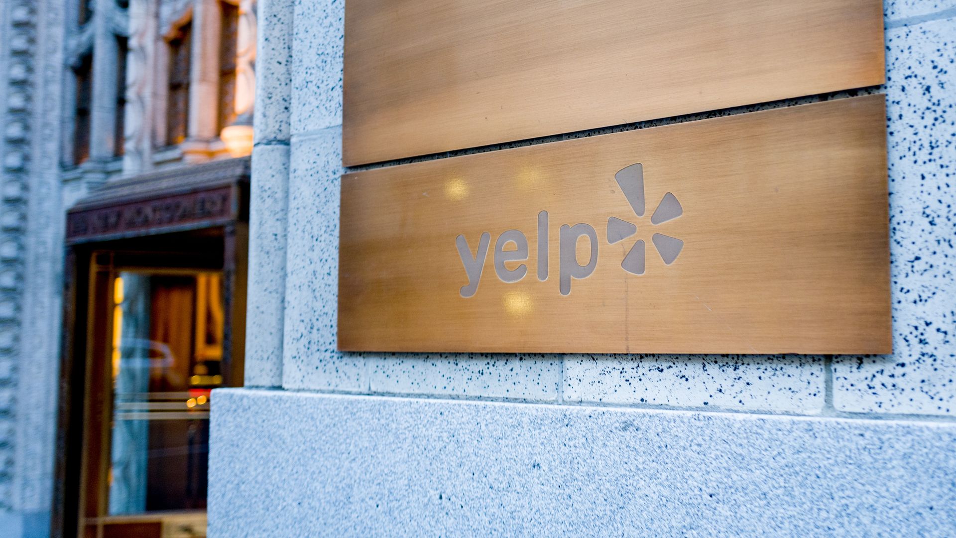 A "Yelp" sign outside its headquarters.