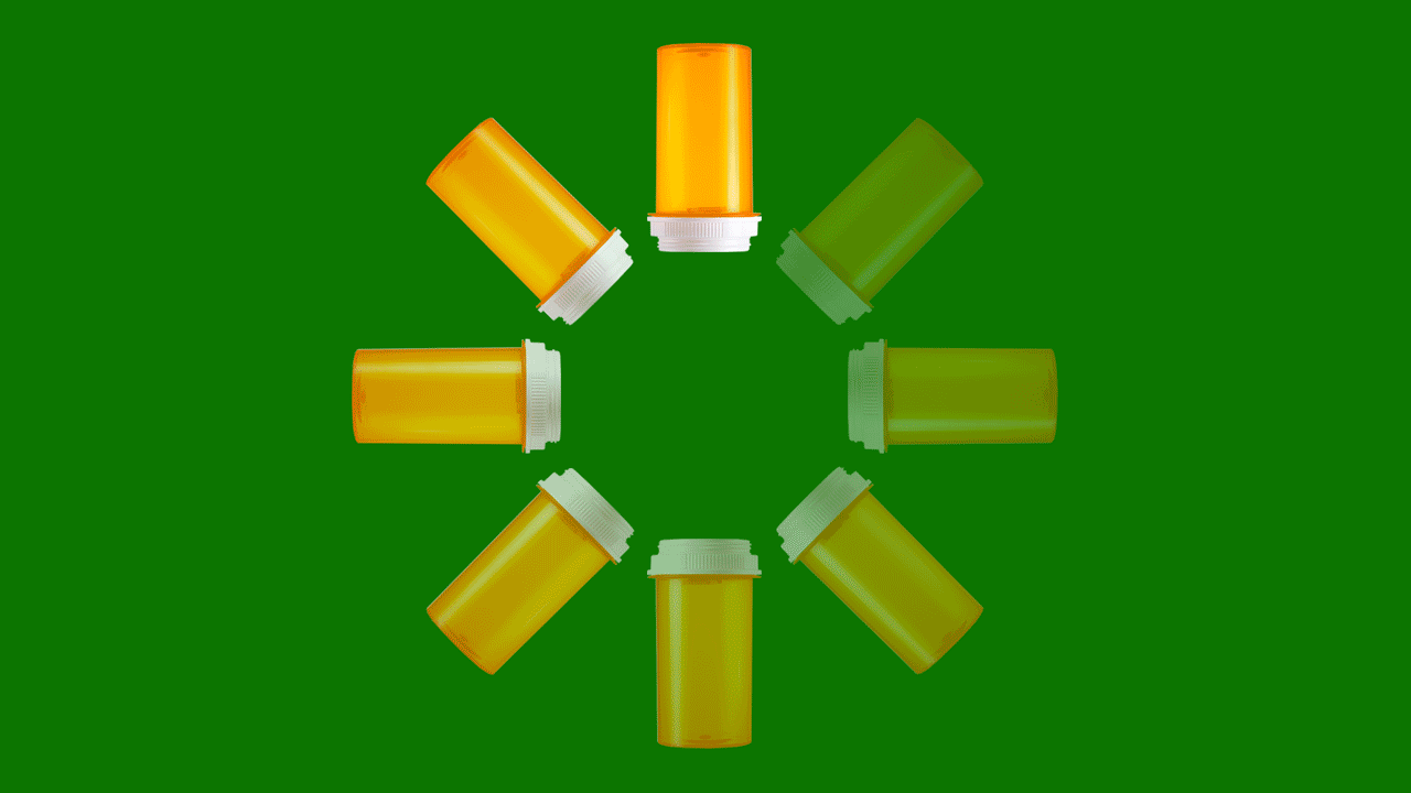 Animated illustration of a rotating loading symbol made from prescription pill bottles.