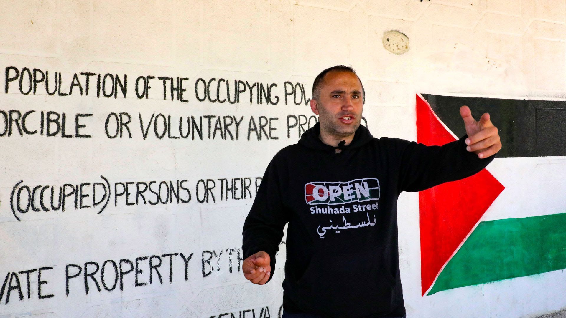 Image of Issa Amro speaking.