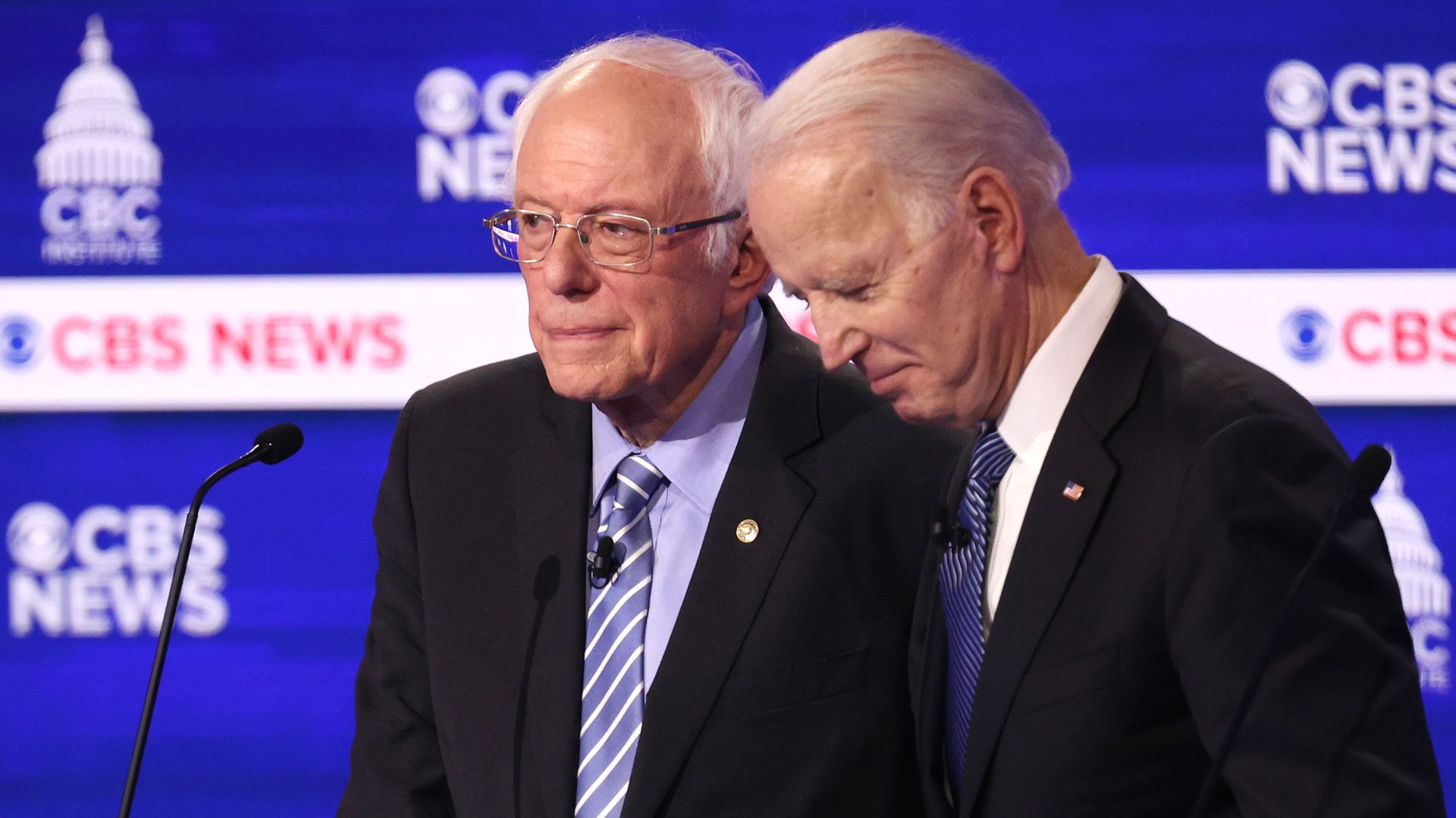 In this image, Sanders and Biden stand next to each other 