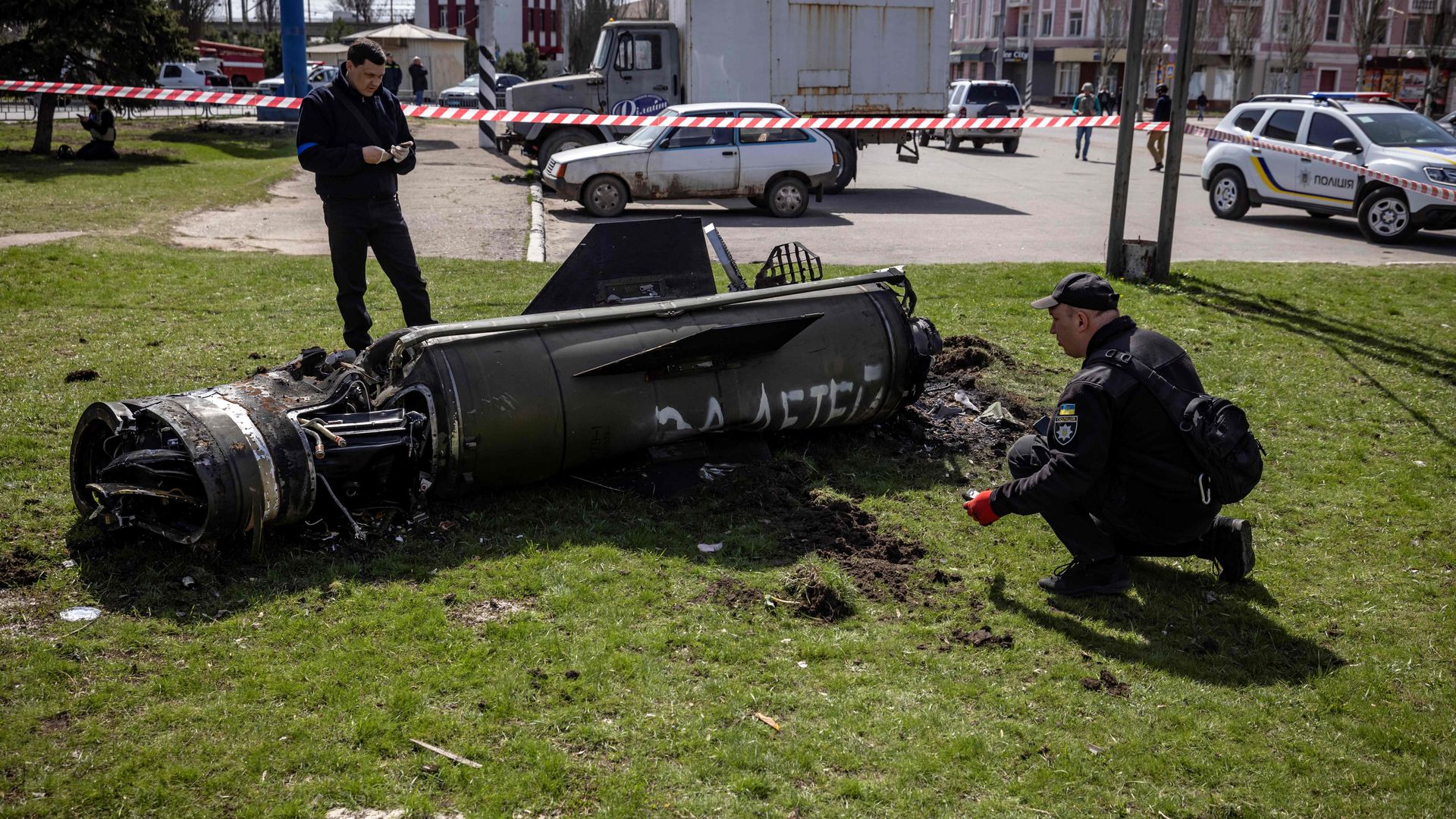 Ukrainian police inspecting a section of a Russian rocket that struck a train station in Kramatorsk, Ukraine, on April 8.