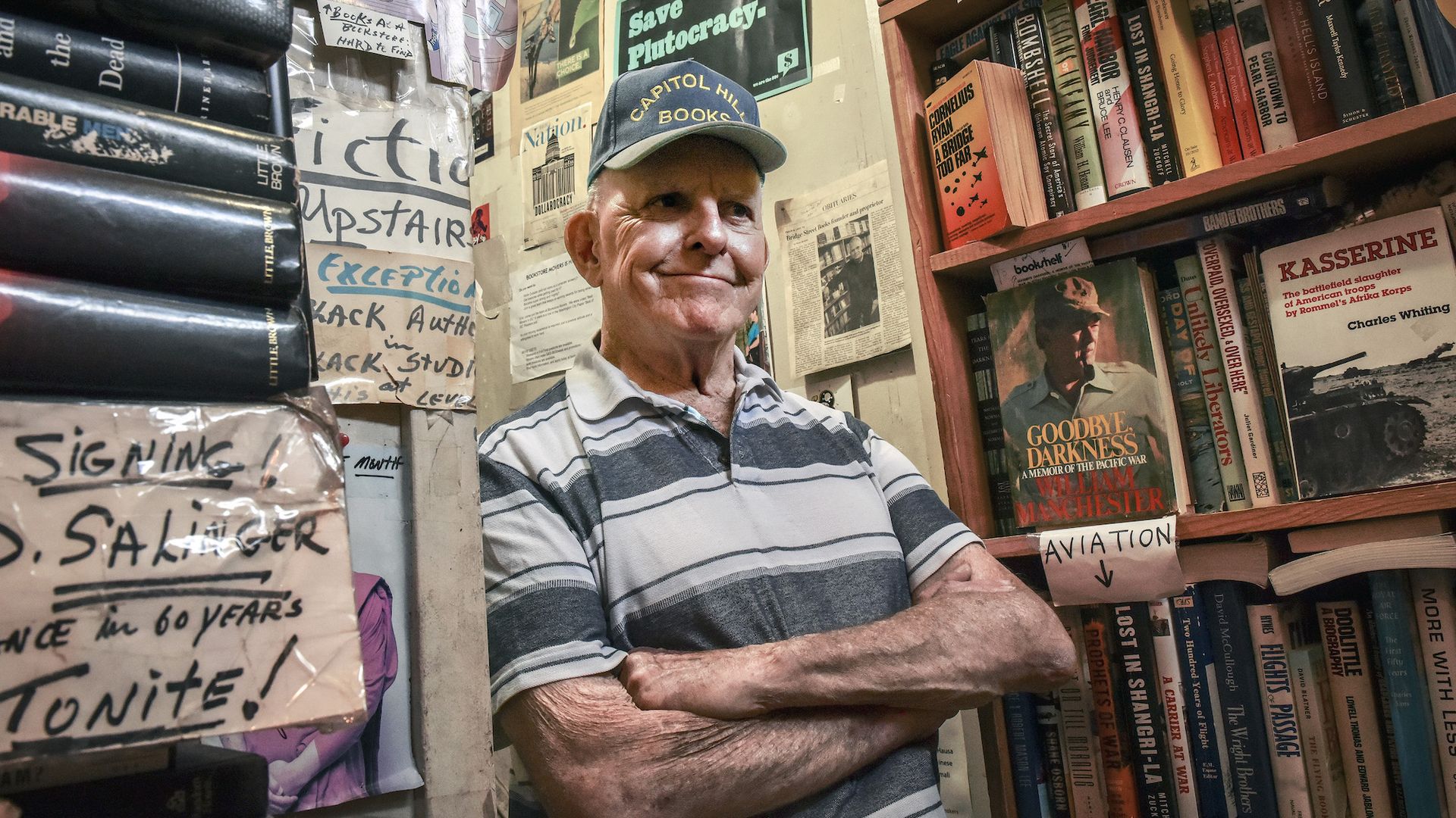 Capitol Hill Books longtime owner and employee Jim Toole among the shelves