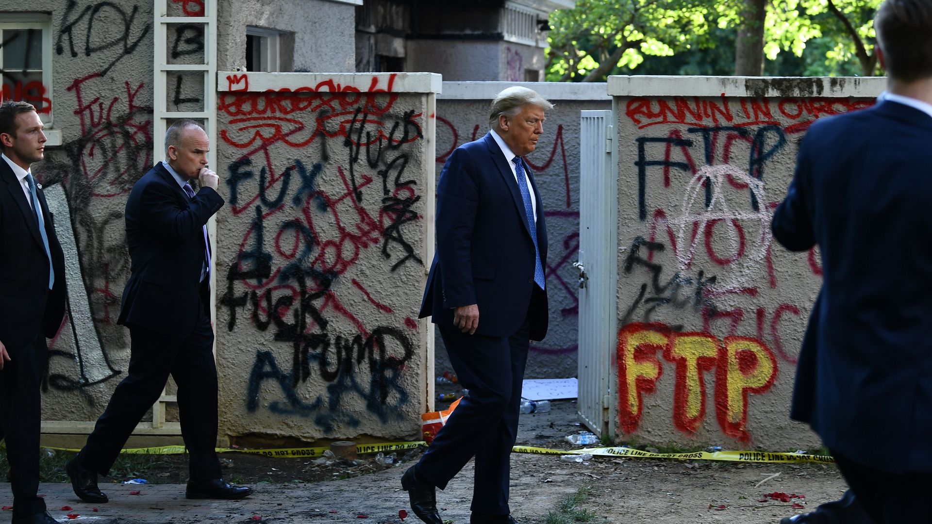Trump walking back to the White House after standing for photos outside St John's Episcopal church across Lafayette Park on June 1.