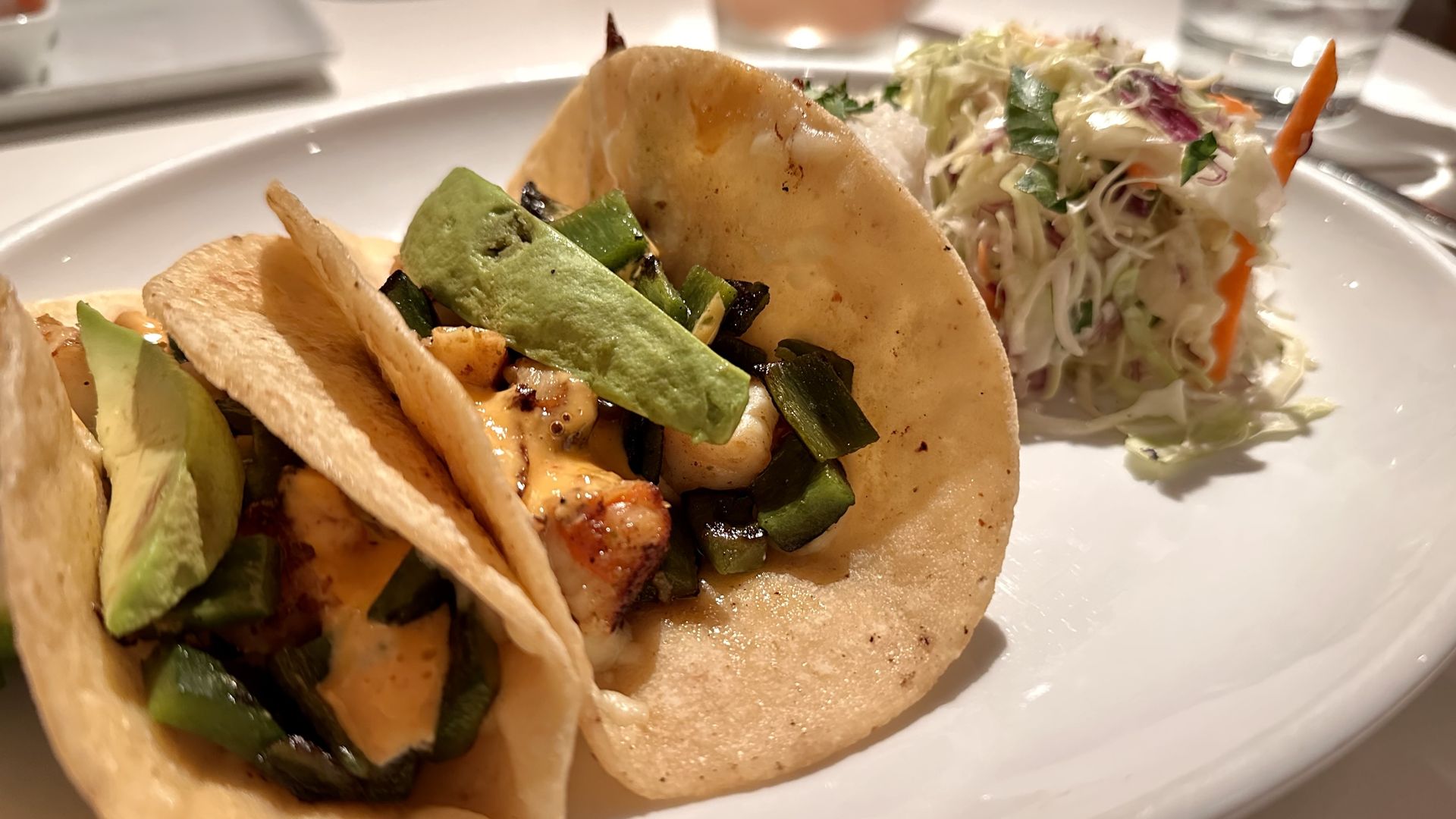 Two tacos and a side of slaw