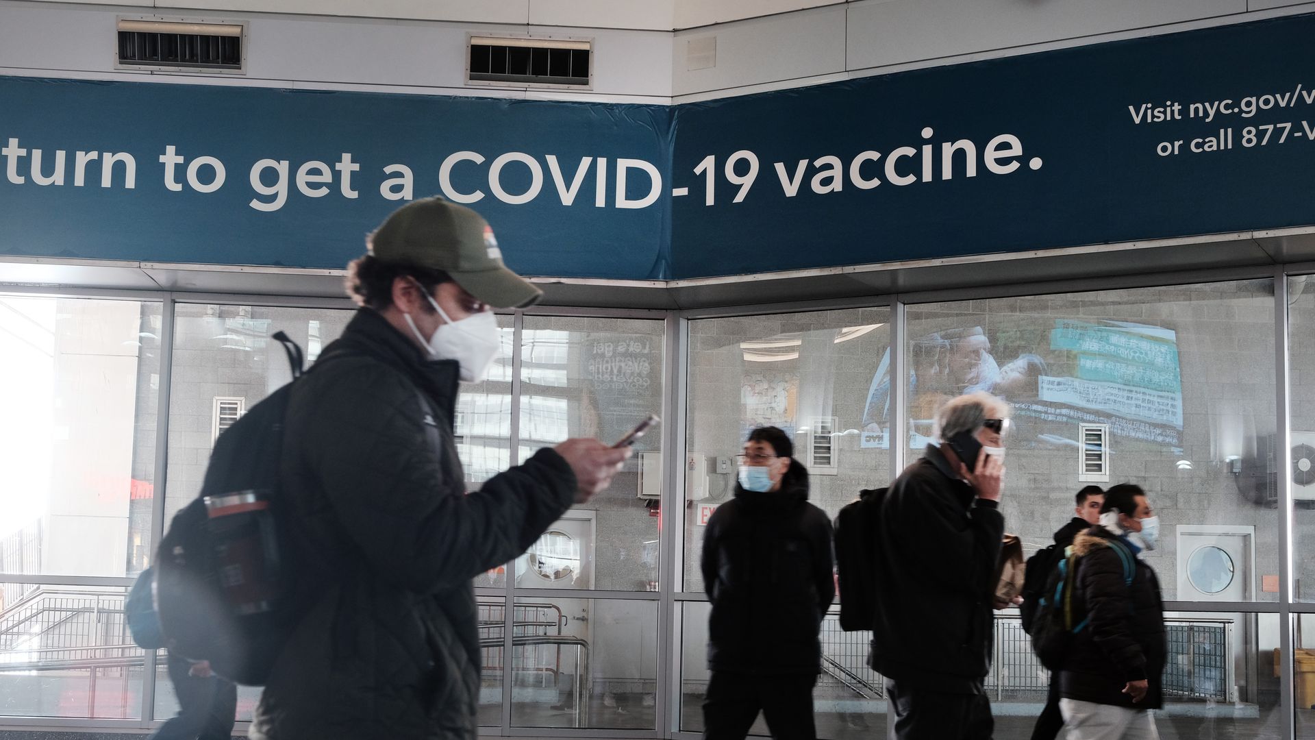 A sign urges people to get the Covid vaccine at the Staten Island Ferry