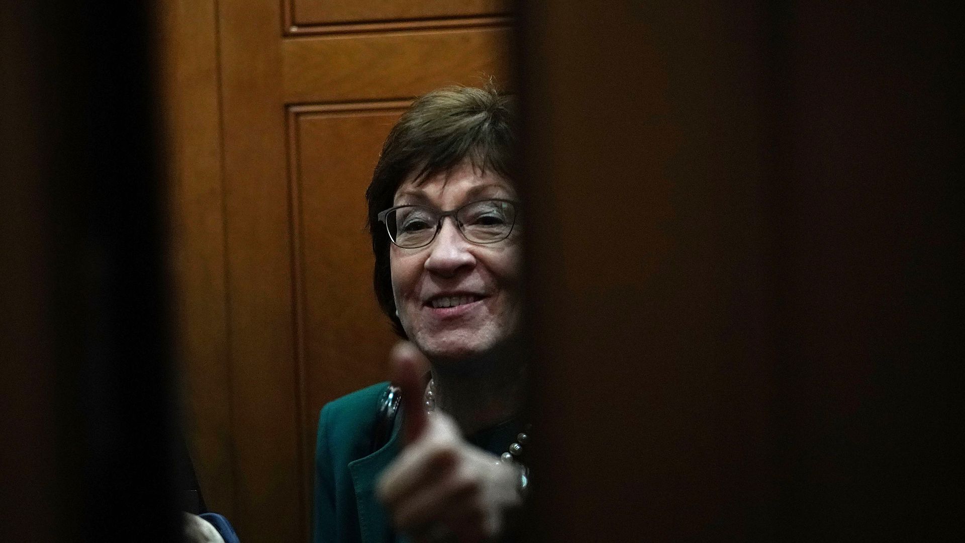 Senator Susan Collins offers a thumbs up