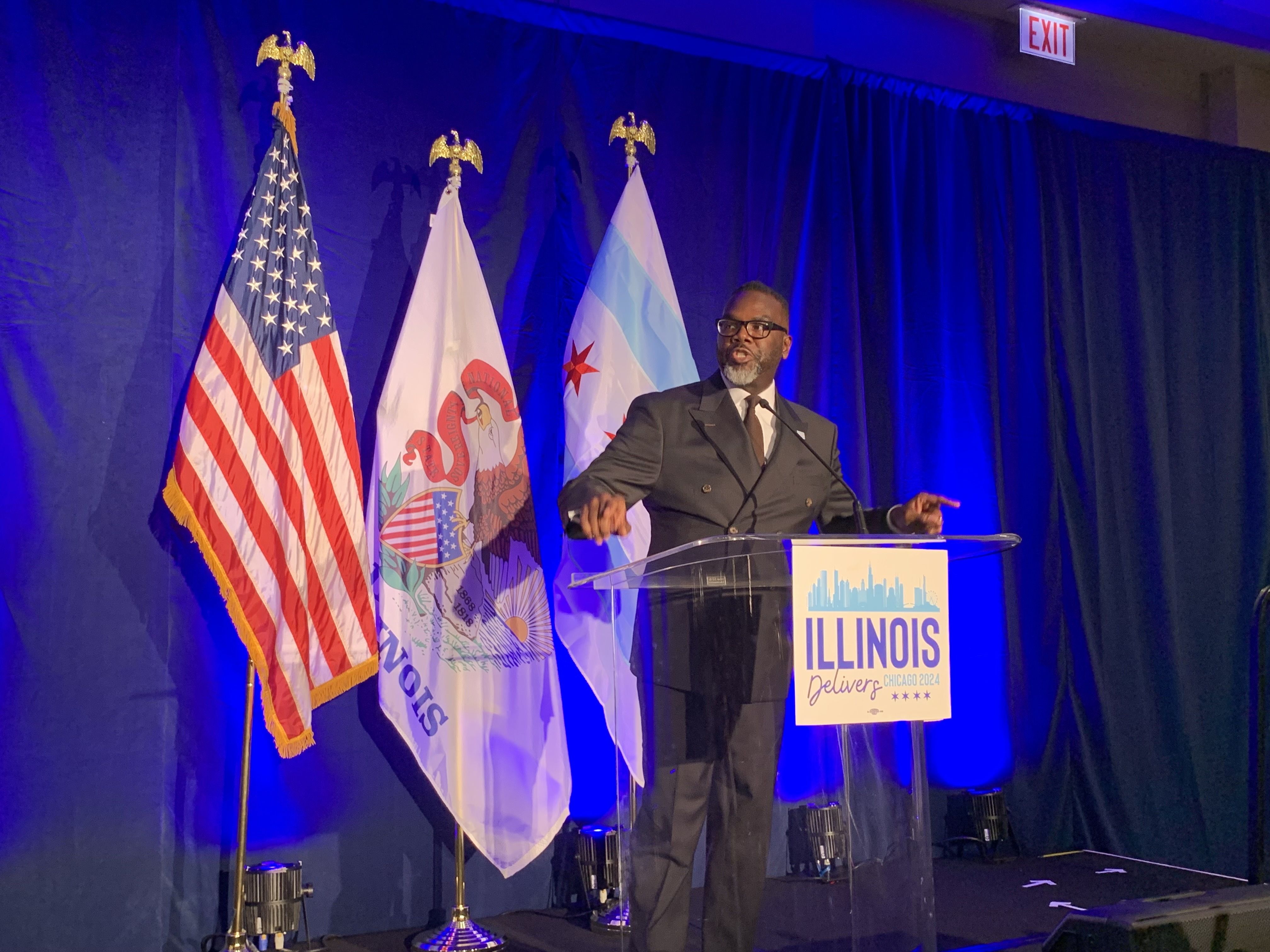 Photo of a man in front of a podium 
