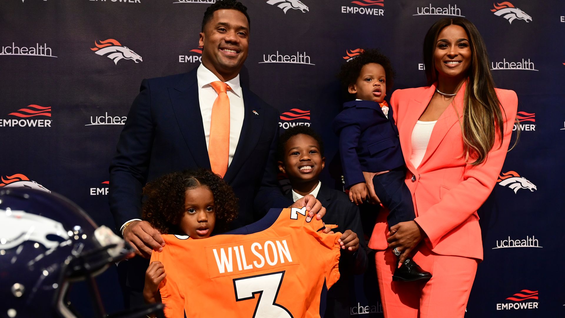Quarterback Russell Wilson is introduced at Denver Broncos Headquarters in Englewood, Colorado on Wednesday, March 16. Also pictured are his wife Ciara, right, children.