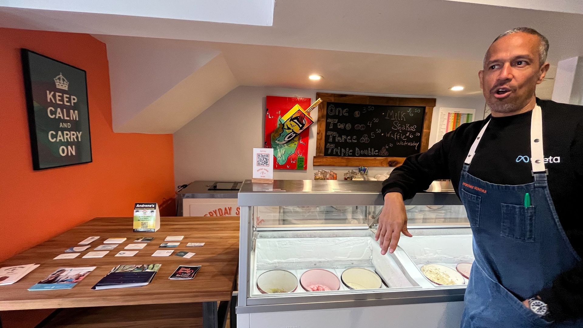 Charles Foreman stands over ice cream freezer
