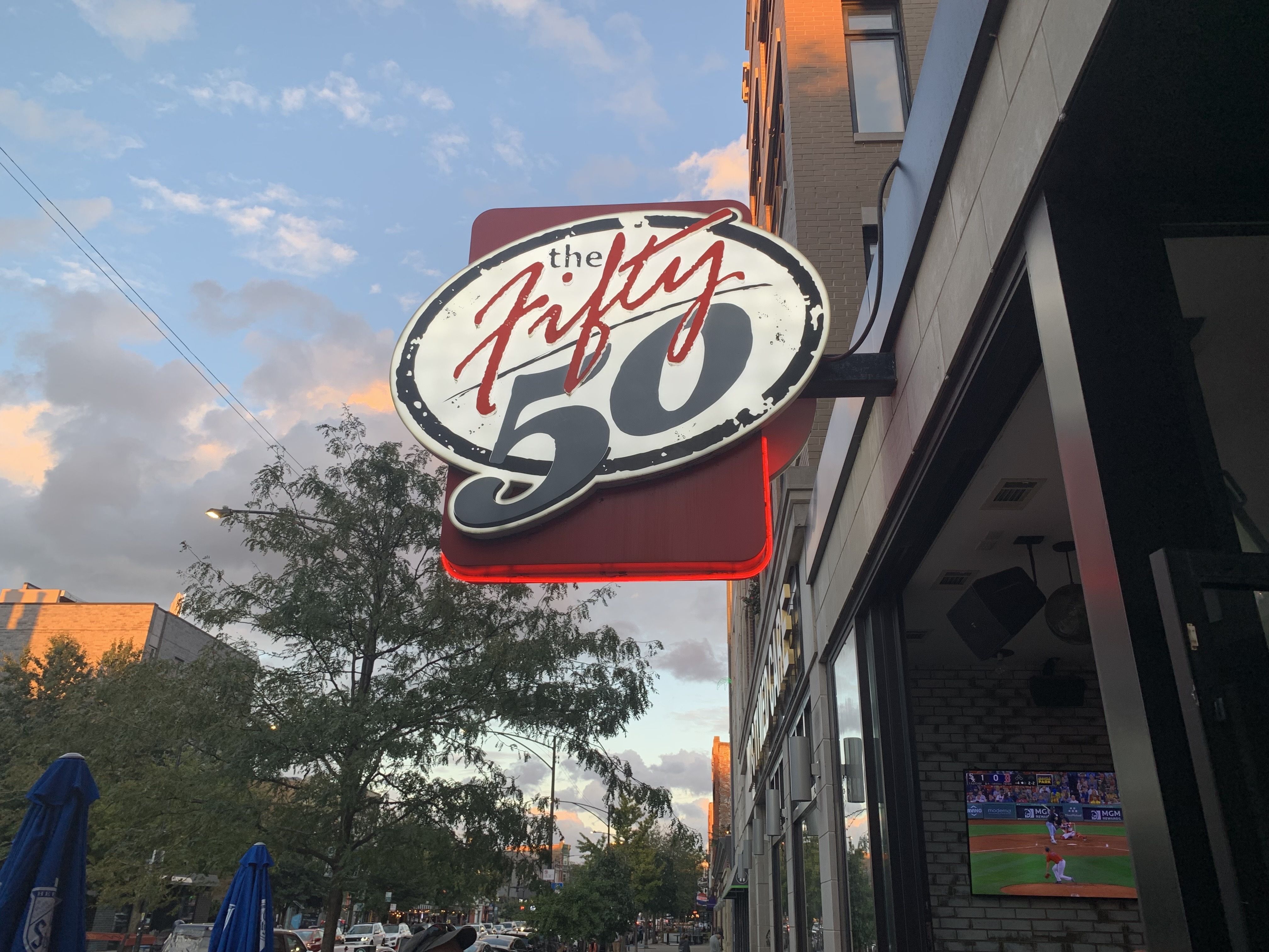 Photo of a sign that says The Fifty/50. 