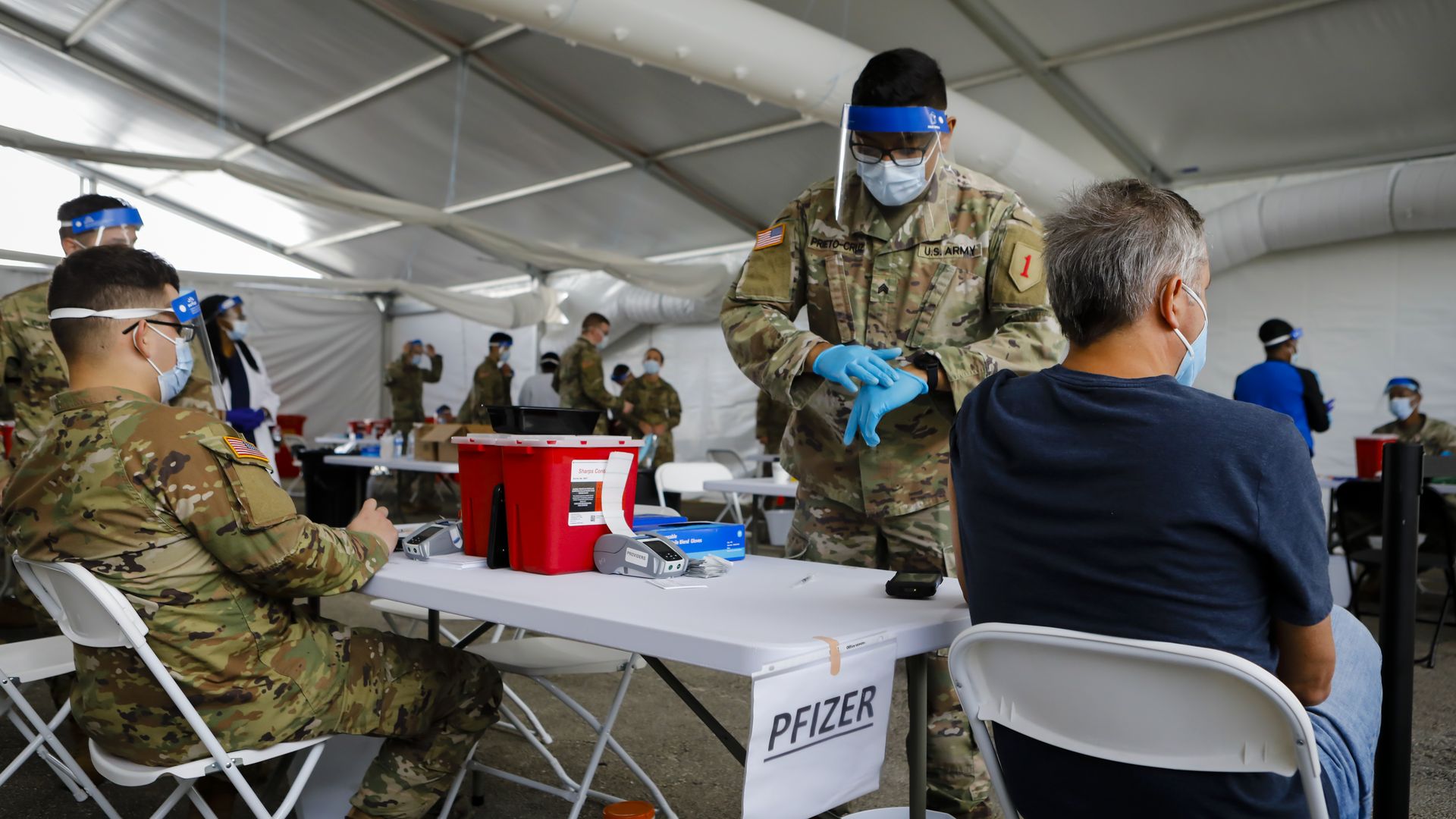  U.S. Army soldier prepares to administer a dose of the Pfizer-BioNTech Covid-19 vaccine.