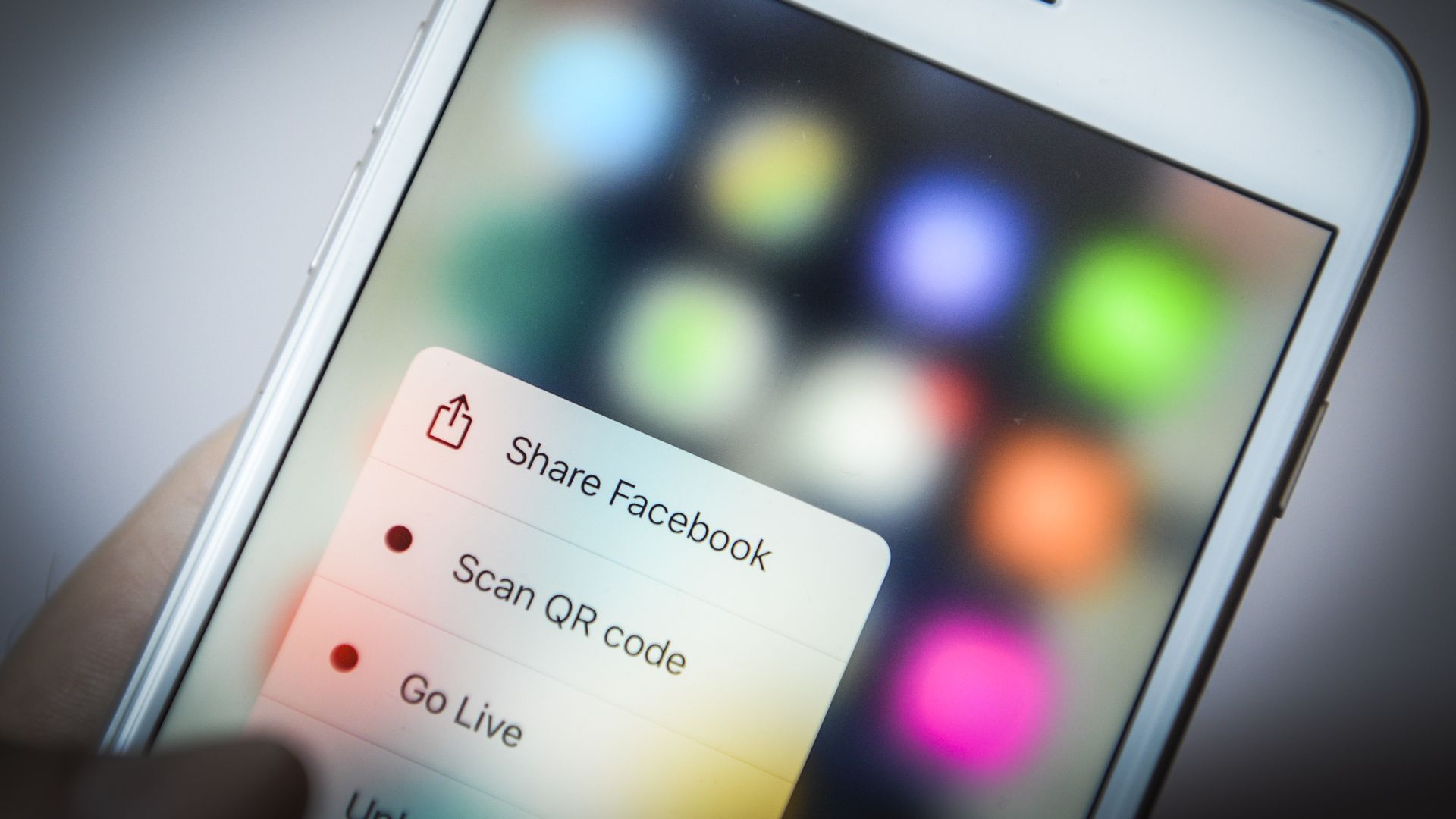 Phone screen with Facebook sharing feature