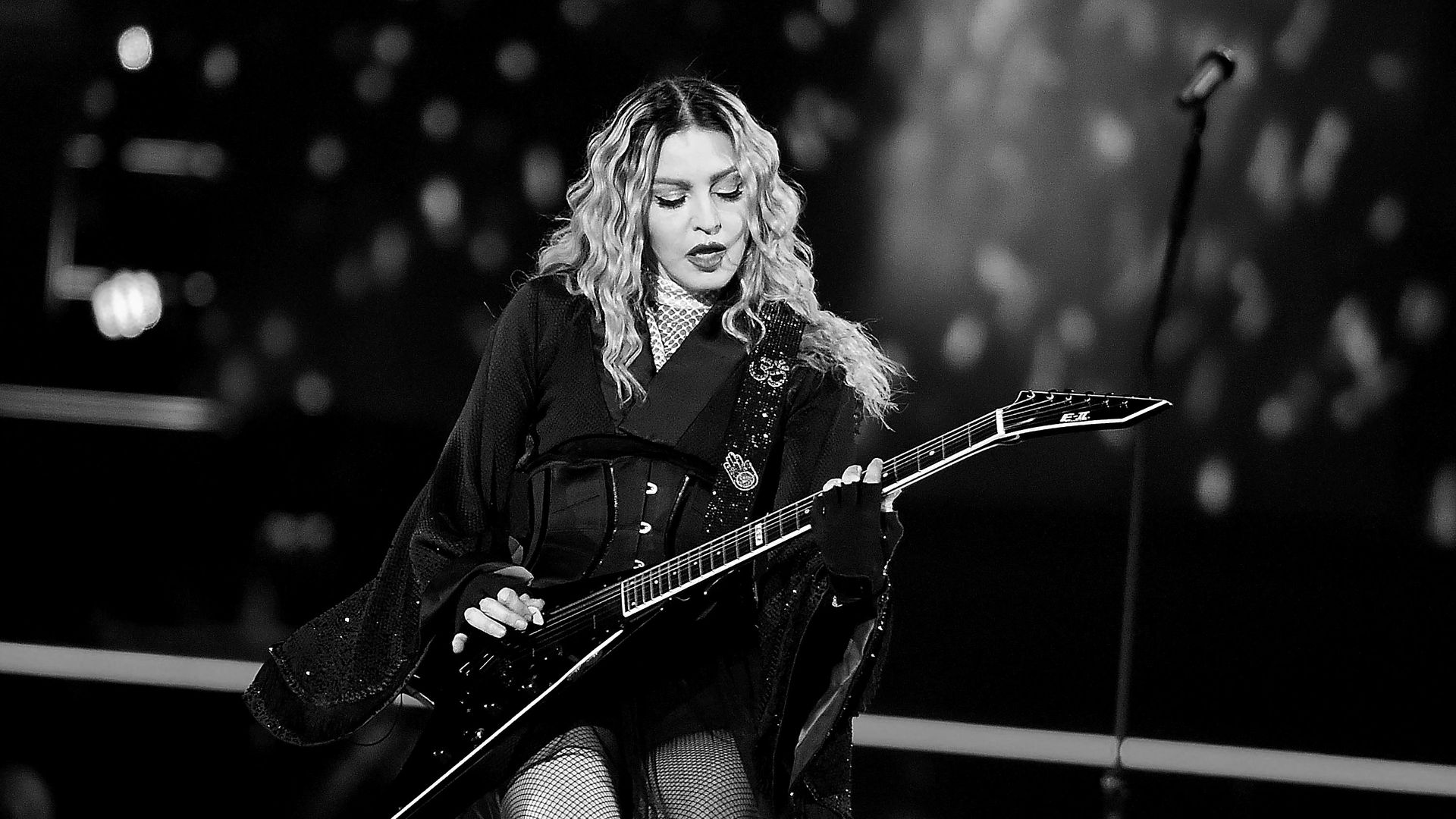 Madonna playing guitar