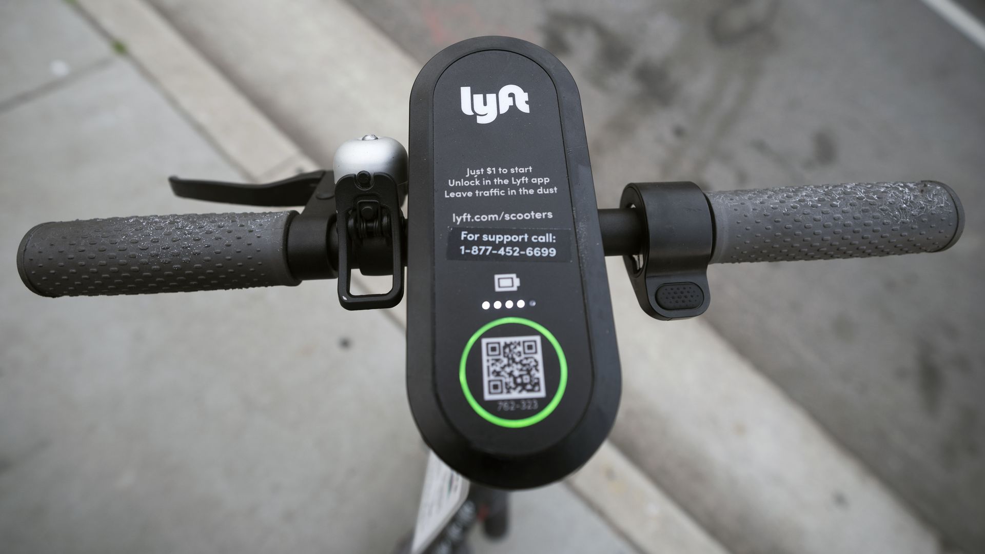 A close-up of the top of a Lyft electric scooter.