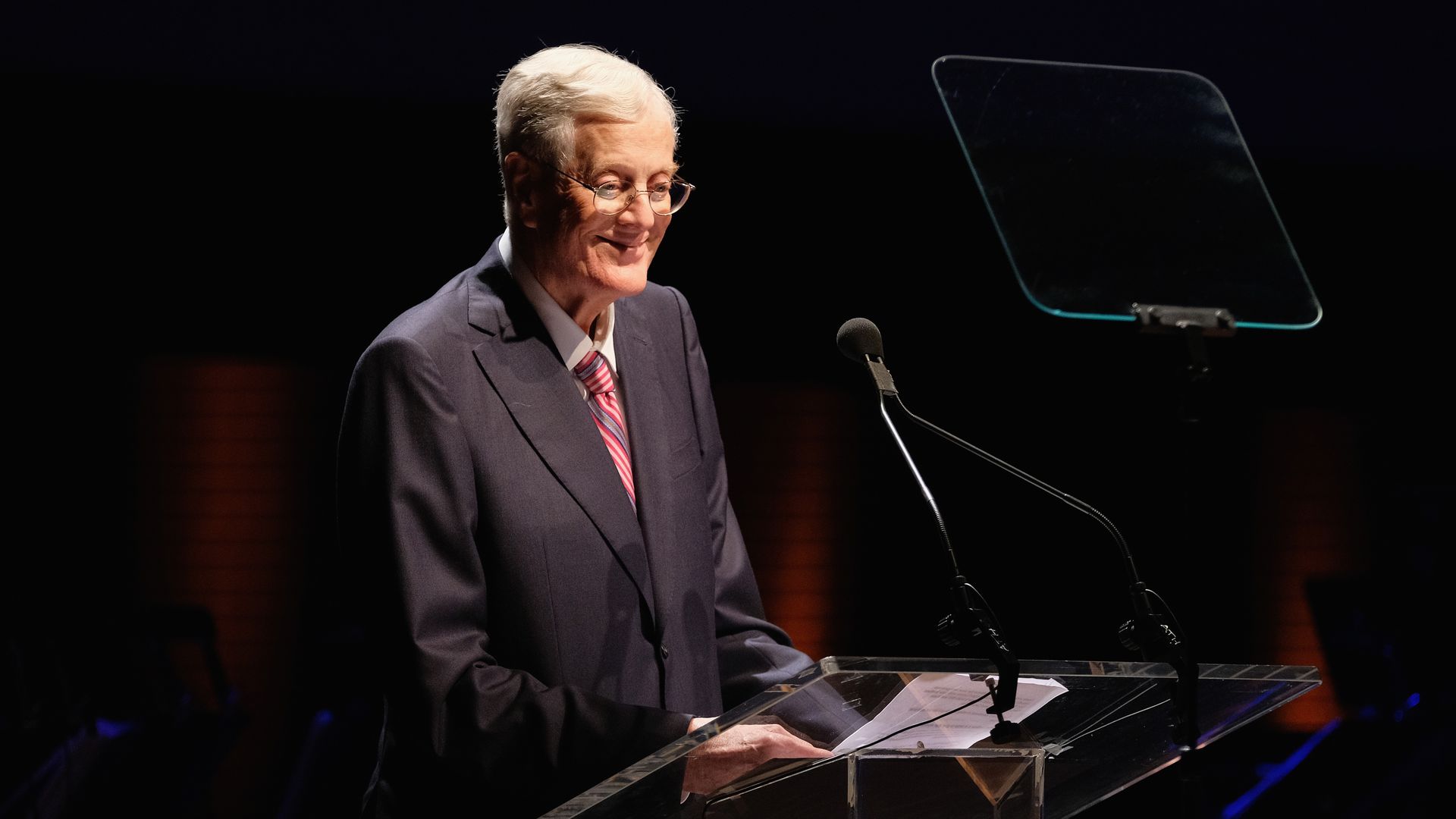 David H. Koch smiles at a podium as he accepts the Laureate Award at the Lincoln Center Spring Gala 
