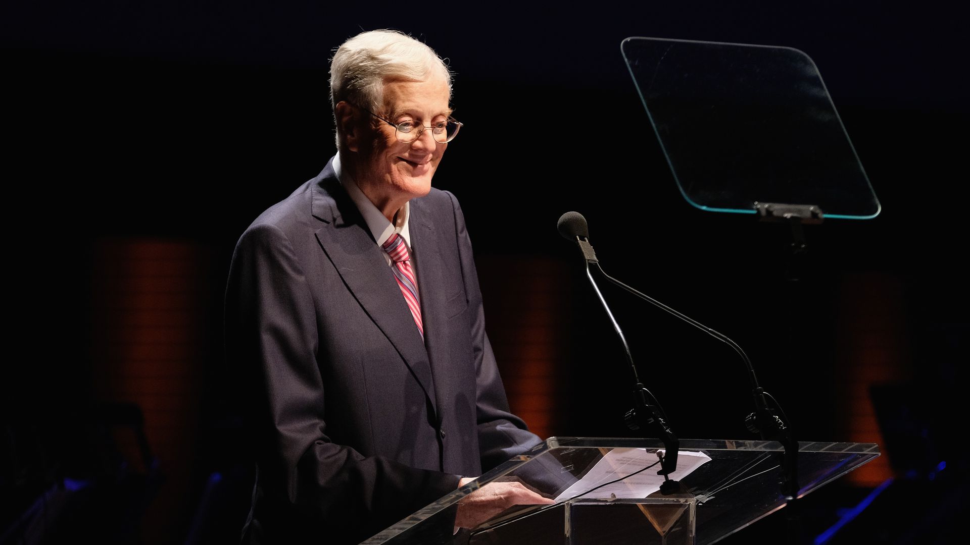 David H. Koch smiles at a podium as he accepts the Laureate Award at the Lincoln Center Spring Gala