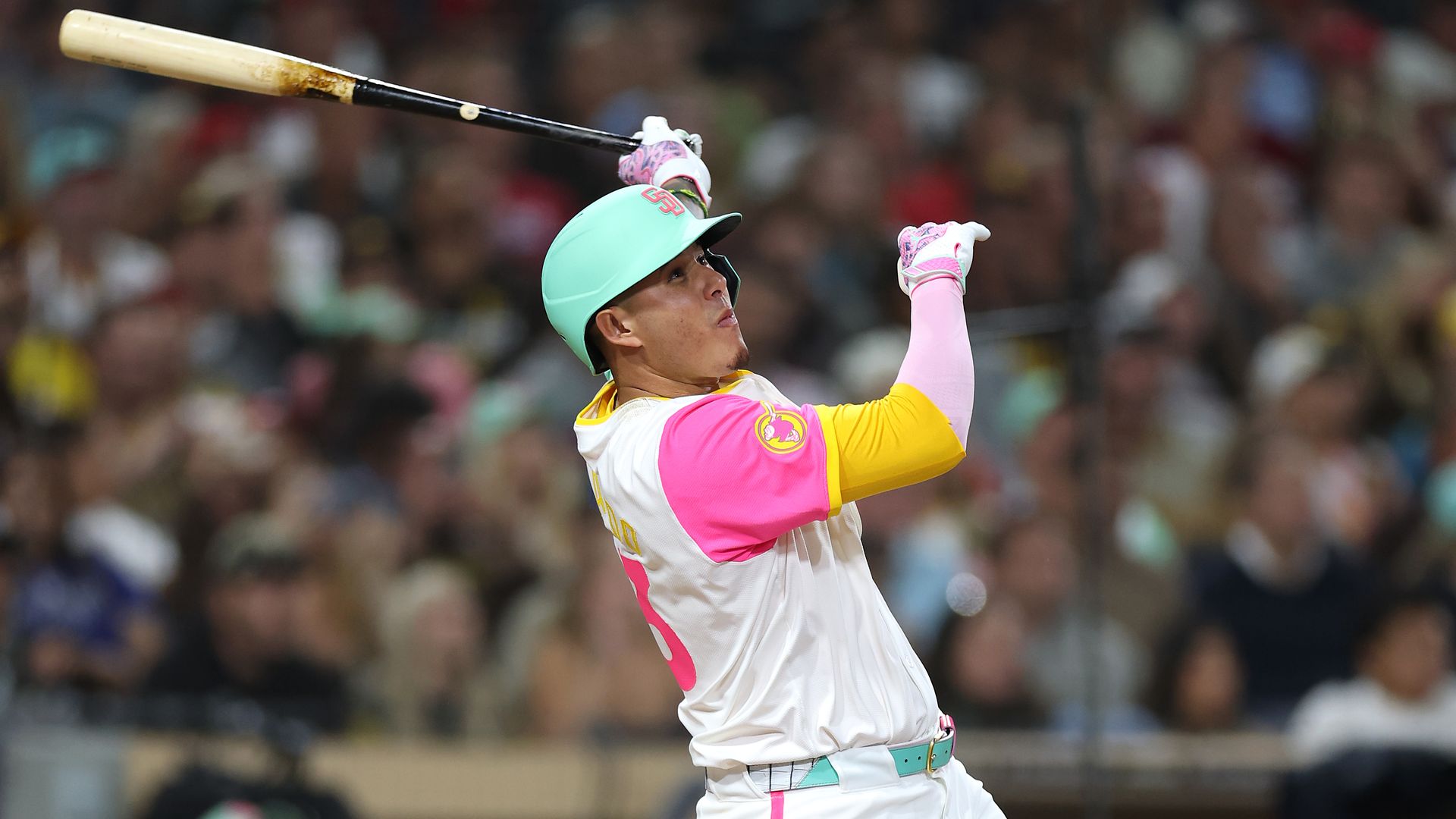 Machado wearing city connect jersey poses after a home run