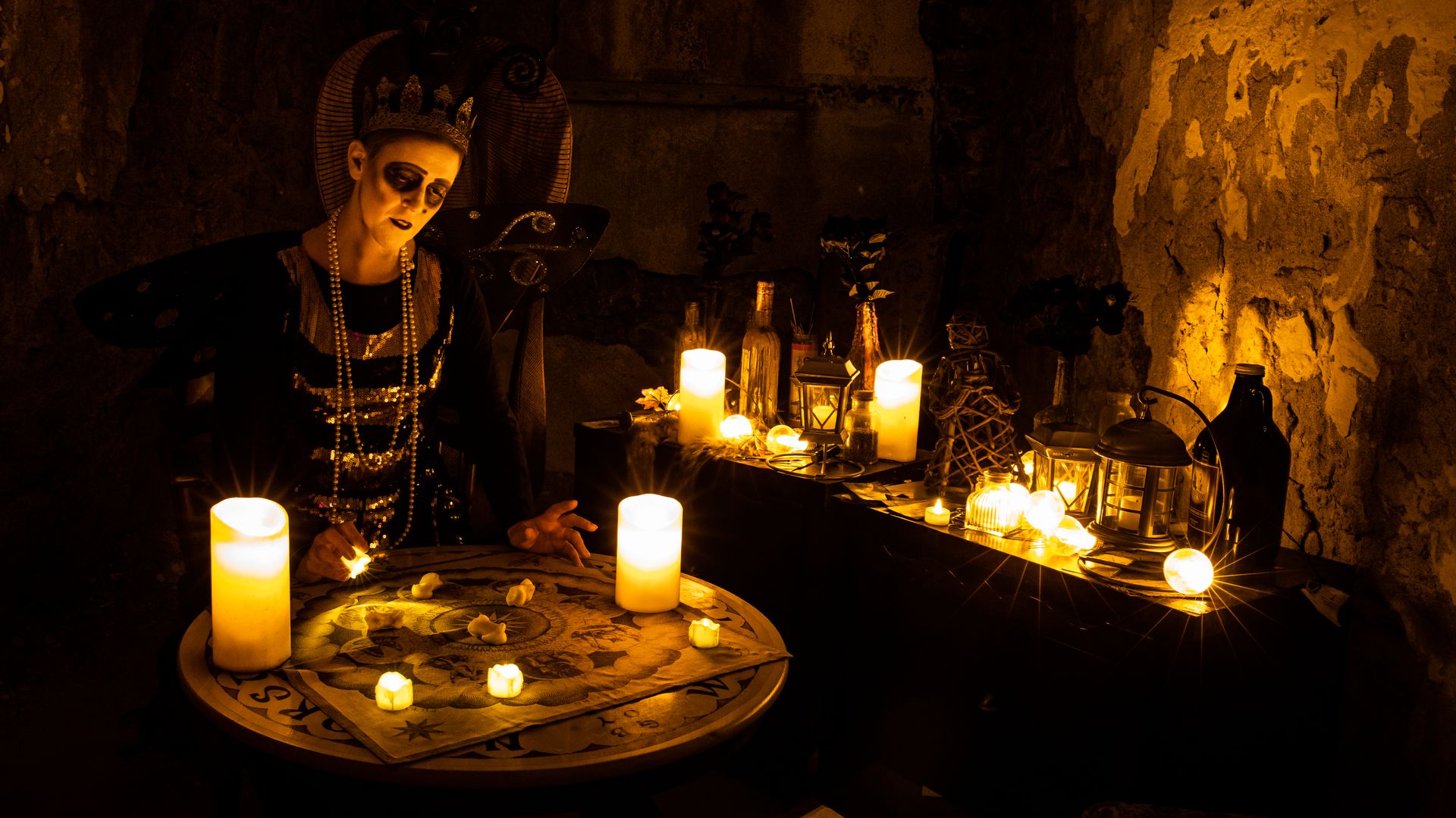 Caption: A fortune teller in the speakeasy bar at Eastern State Penitentiary's “Halloween Nights.”  