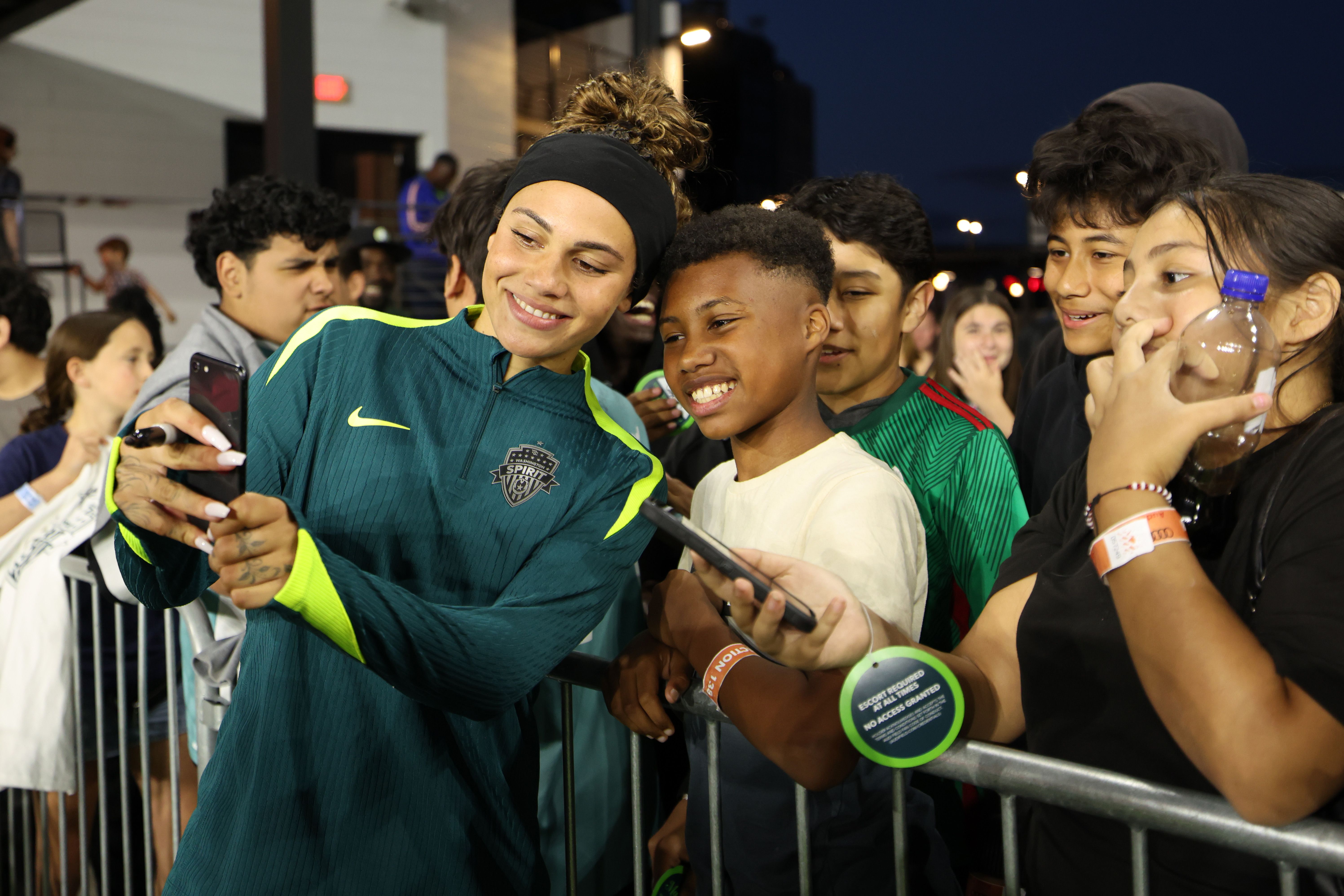 Trinity Rodman, #2 of Washington Spirit, takes a selfie with the fans after the NWSL match between the Washington Spirit and Seattle Reign at Audi Field on May 30 in Washington, D.C.