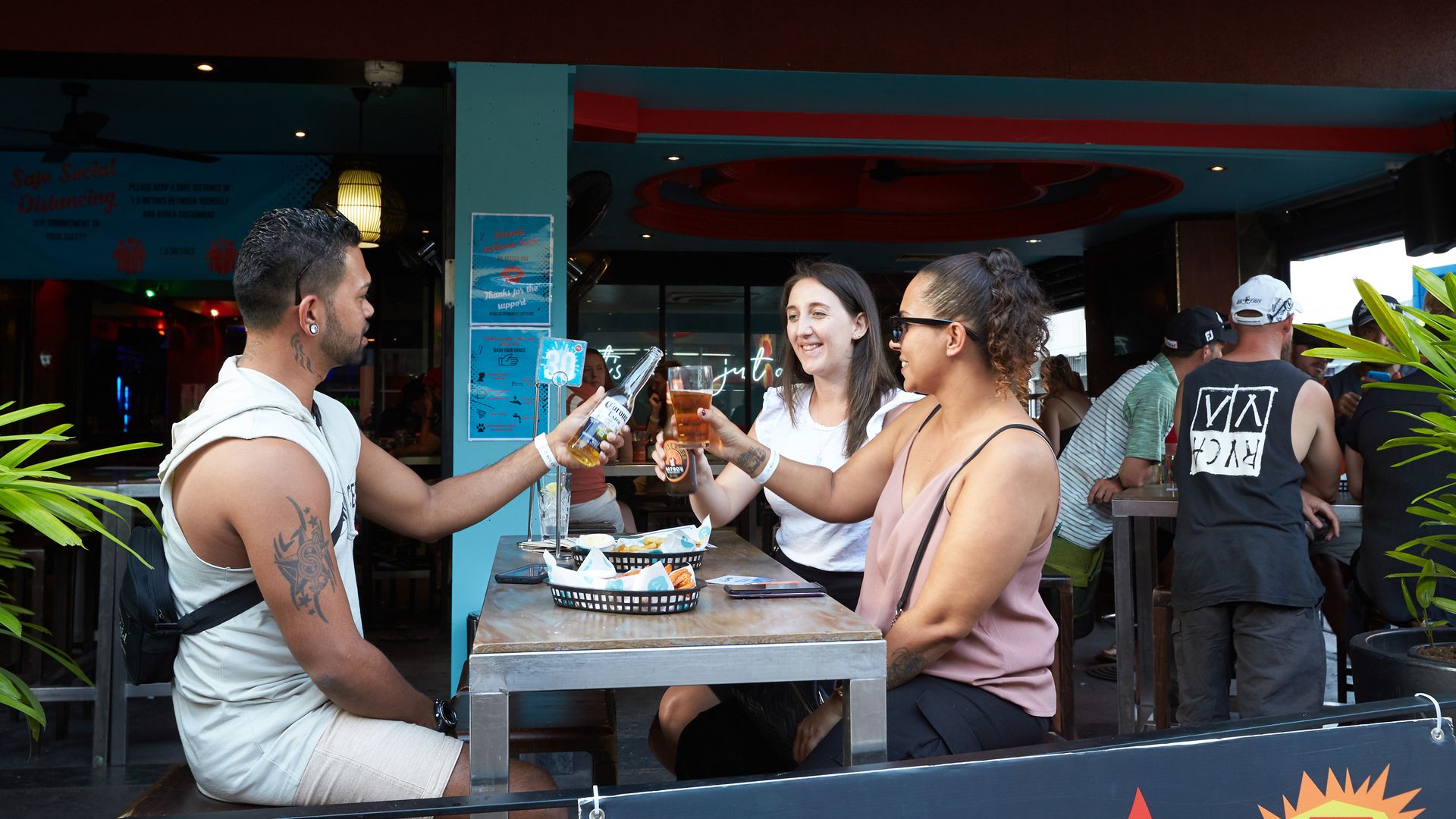 People eat and drink as they sit at Monsoons Bar on Mitchell st on May 15, 2020 in Darwin, Australia. 