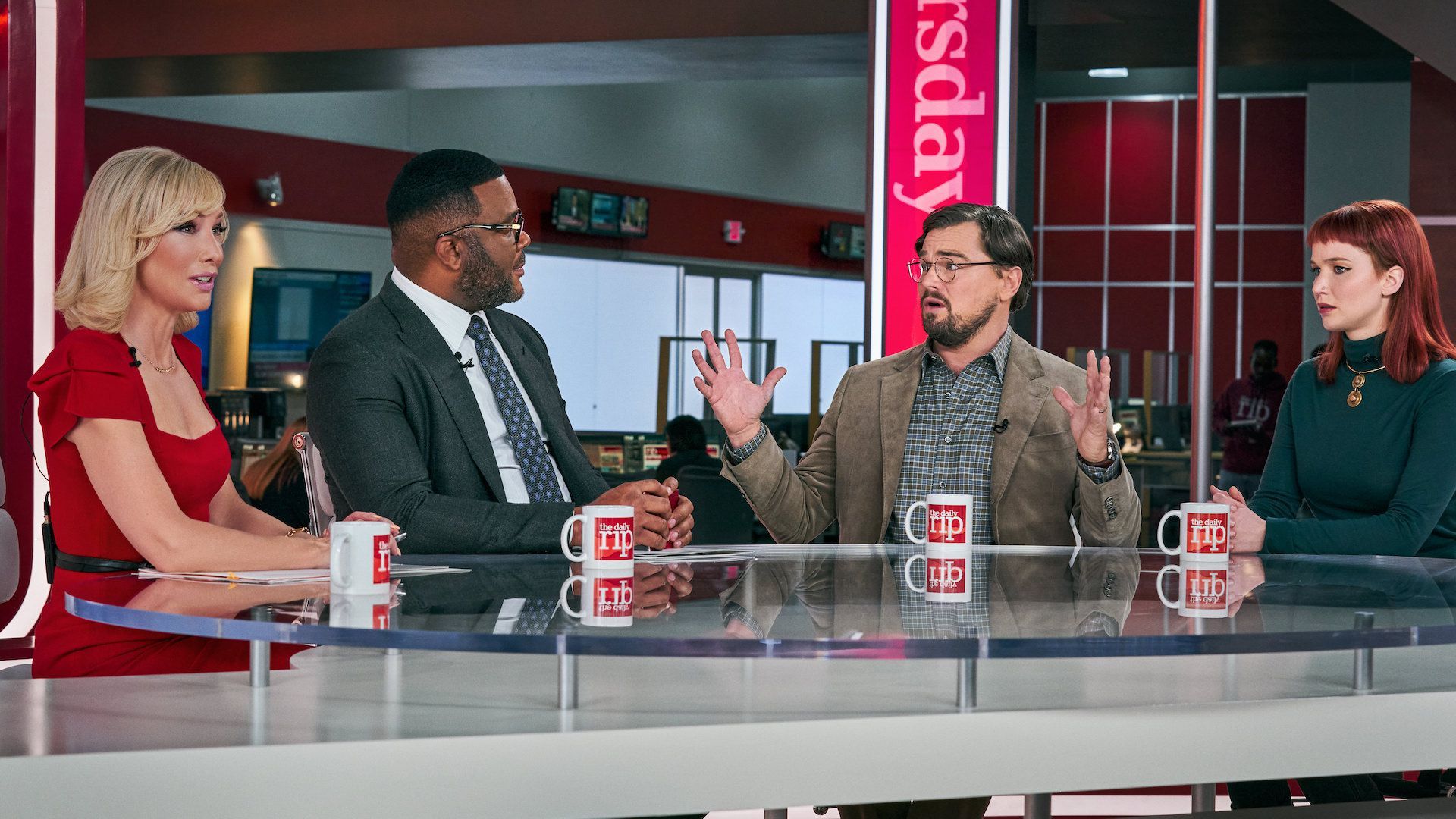 Cate Blanchett (L), Tyler Perry, Leonardo DiCaprio and Jennifer Lawrence in a scene from the new movie "Don't Look Up." (Netflix)