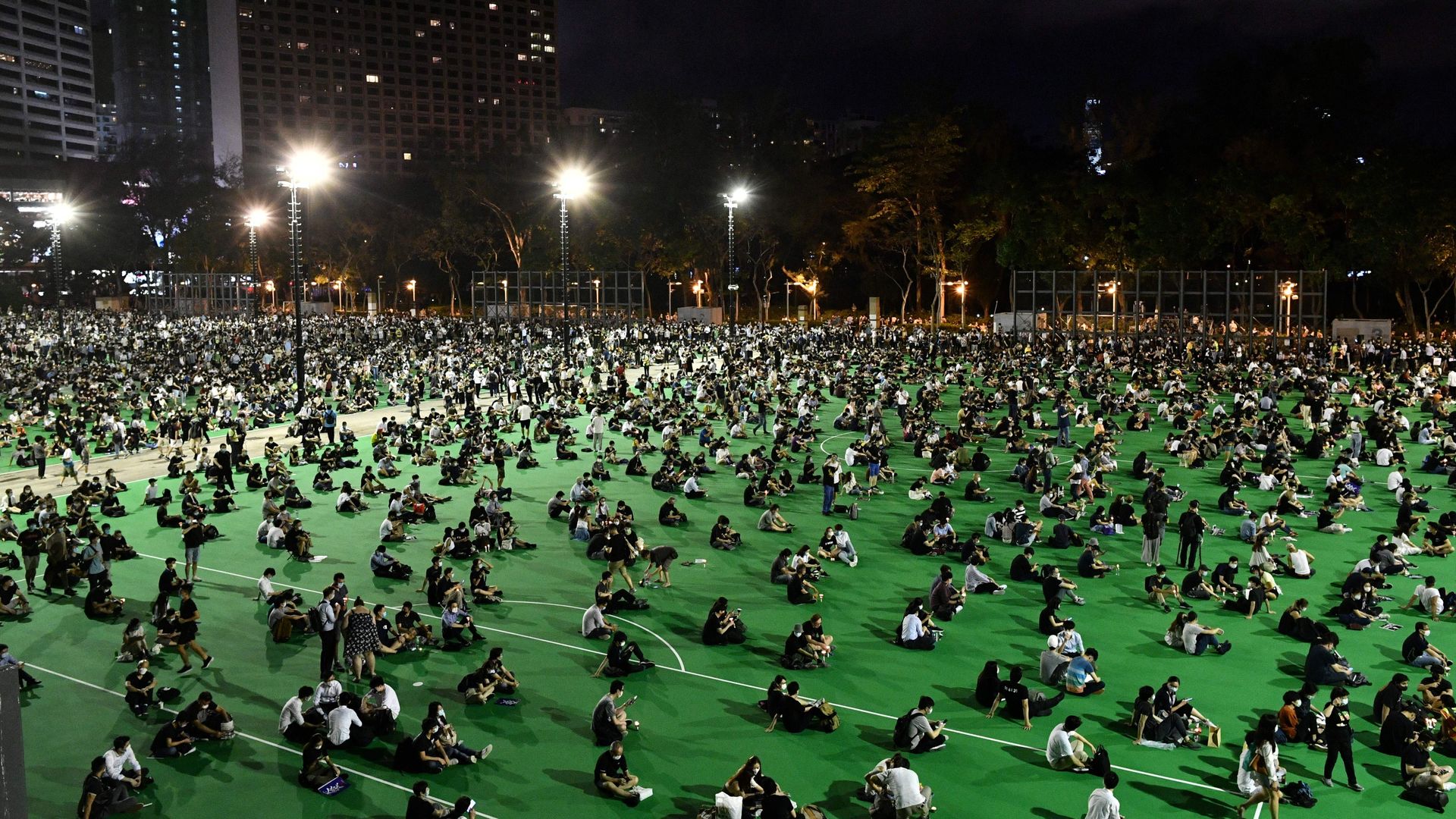 Activists holding a candlelit remembrance to mark the 1989 Tiananmen Square crackdown outside Victoria Park in Hong Kong on June 4, 2020.