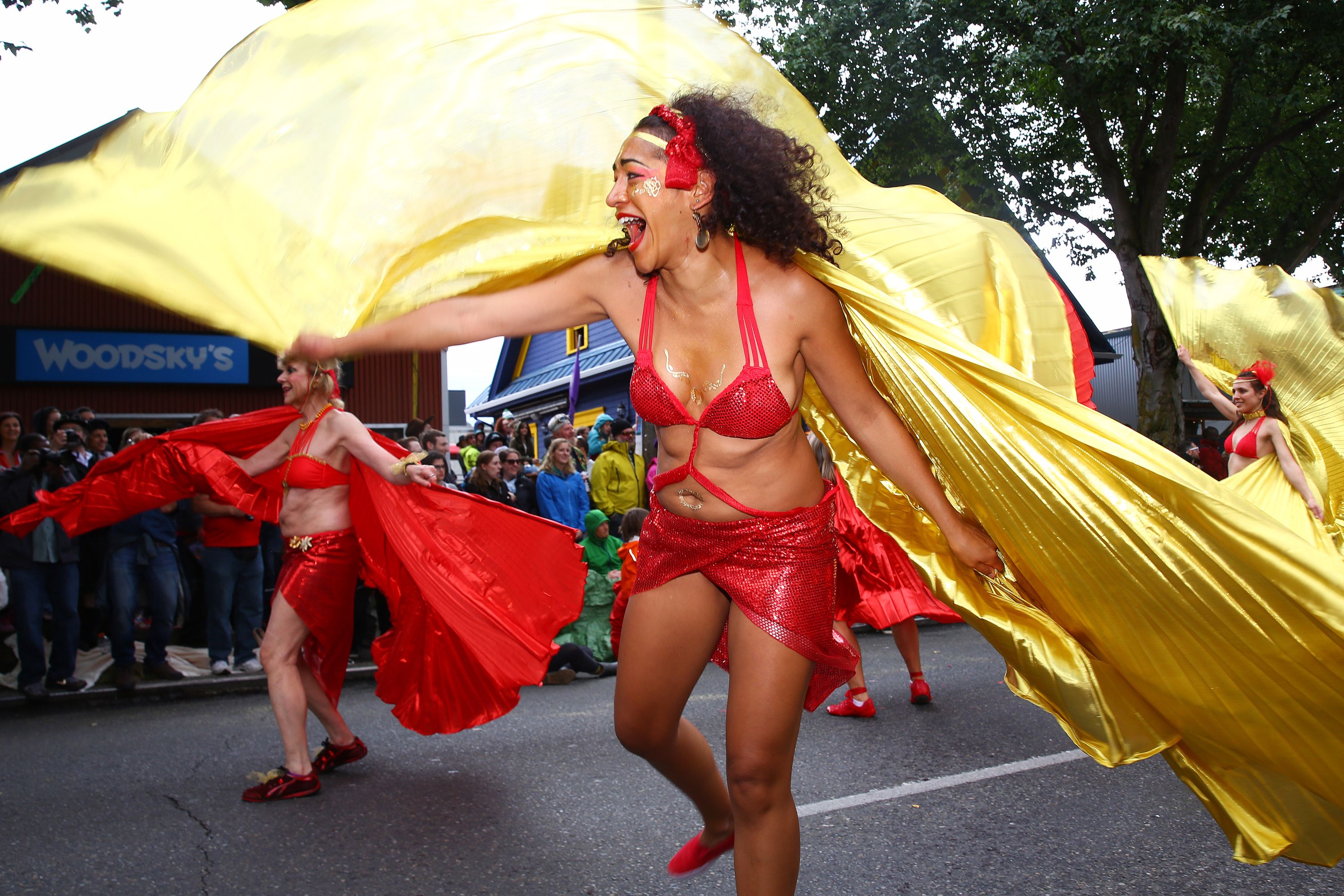 Dancers in red and gold costumes perform during the Fremont Solstice Parade in 2019. 