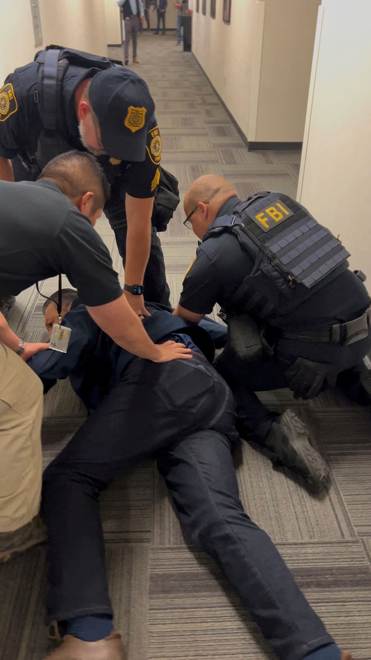 Sen. Alex Padilla is held down on the floor before being handcuffed outside of Homeland Security Secretary Kristi Noem's press conference in L.A. yesterday.