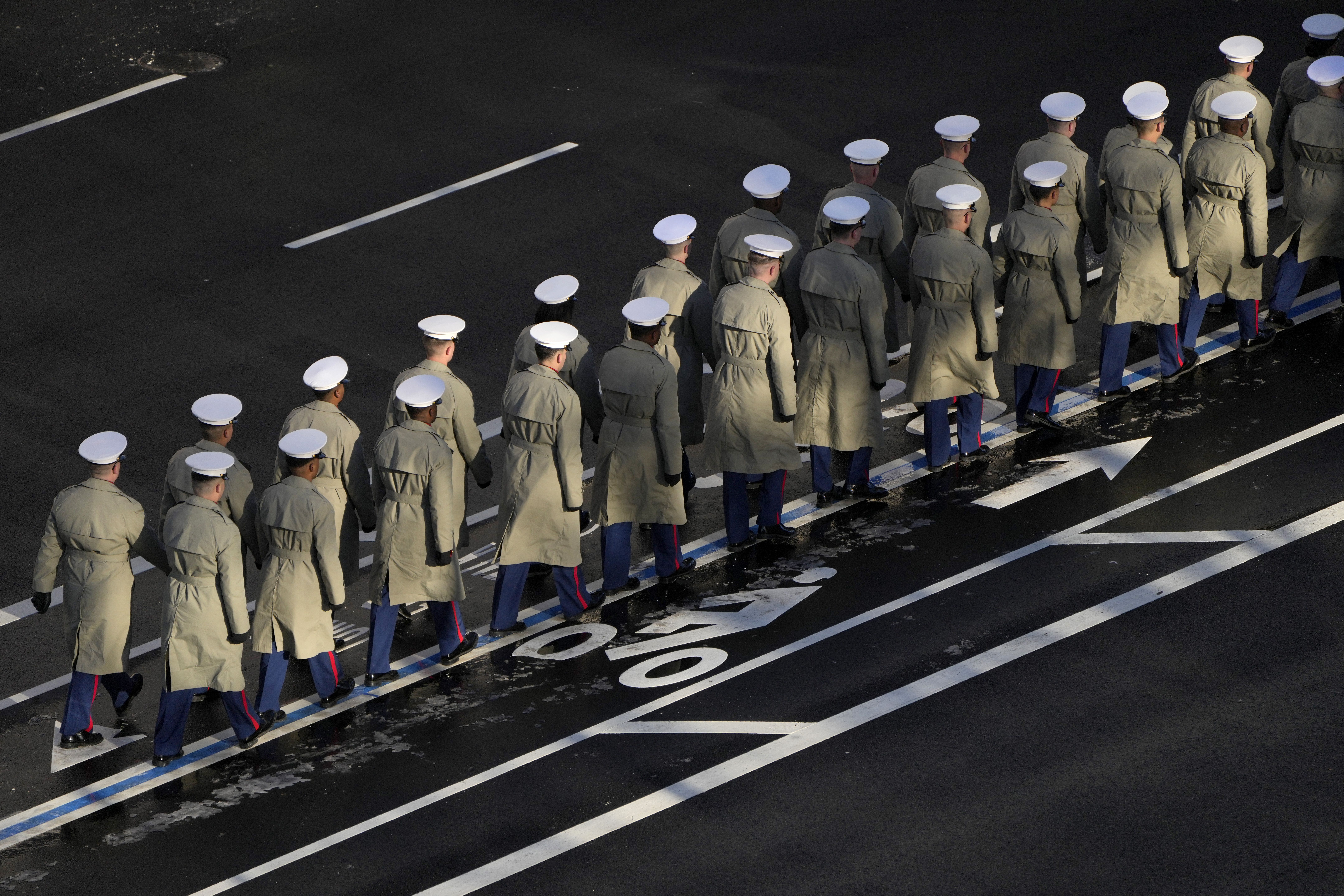 Members of the U.S. Navy line up to march with the casket of former President Jimmy Carter before it arrives at the U.S. Navy Memorial to travel to the Capitol on January 7, 2025 in Washington, DC. Carter's body will lie in state in the Capitol Rotunda until a funeral service at the National Cathedr