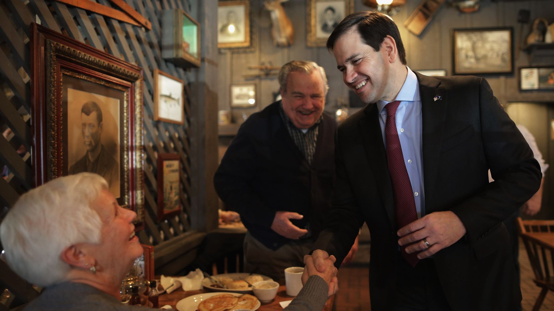Sen. Marco Rubio is seen shaking hands inside a Cracker Barrel restaurant in 2016.